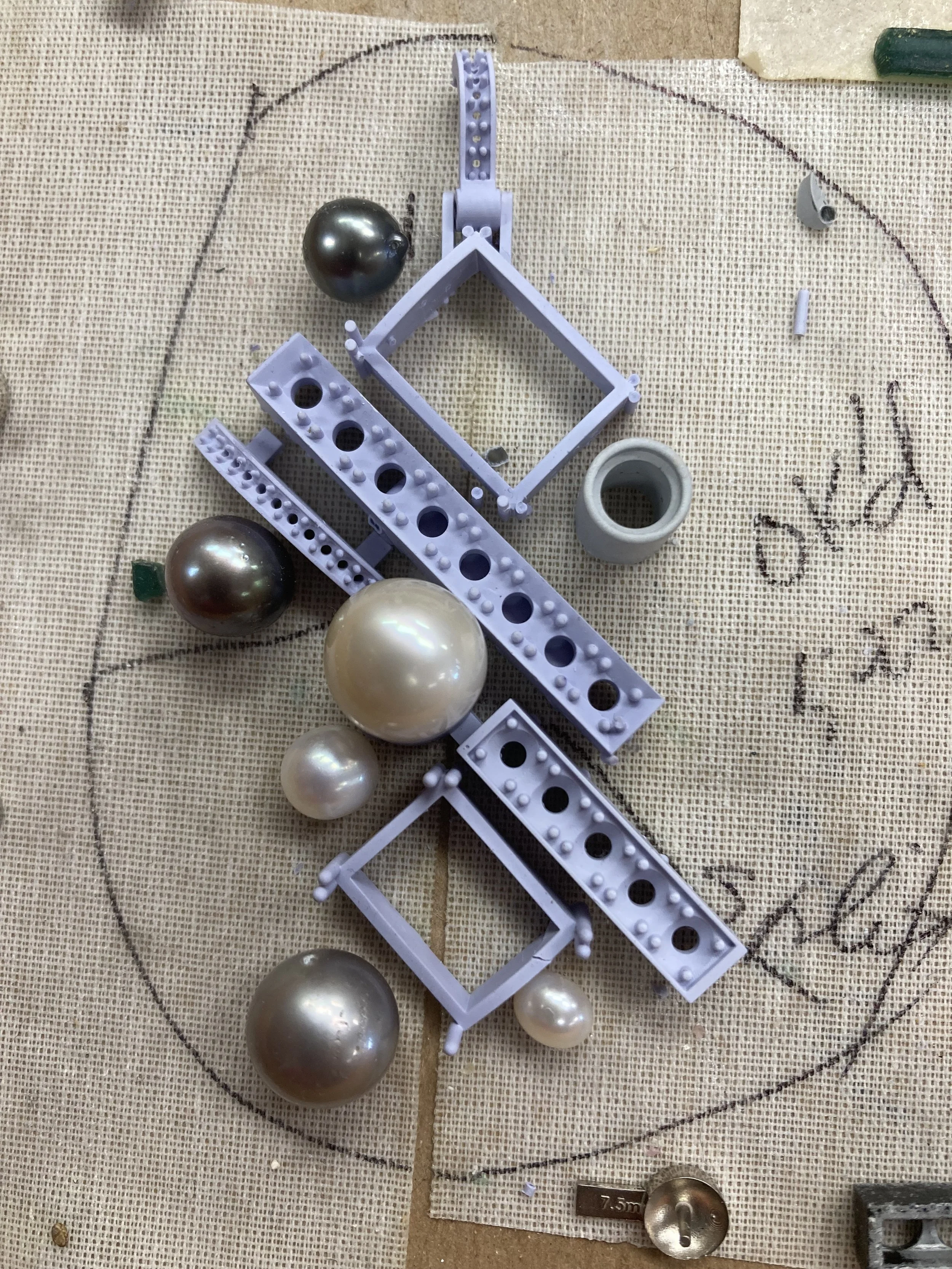 The pendant is composed of two distinct sections connected by a precision-engineered catch mechanism
