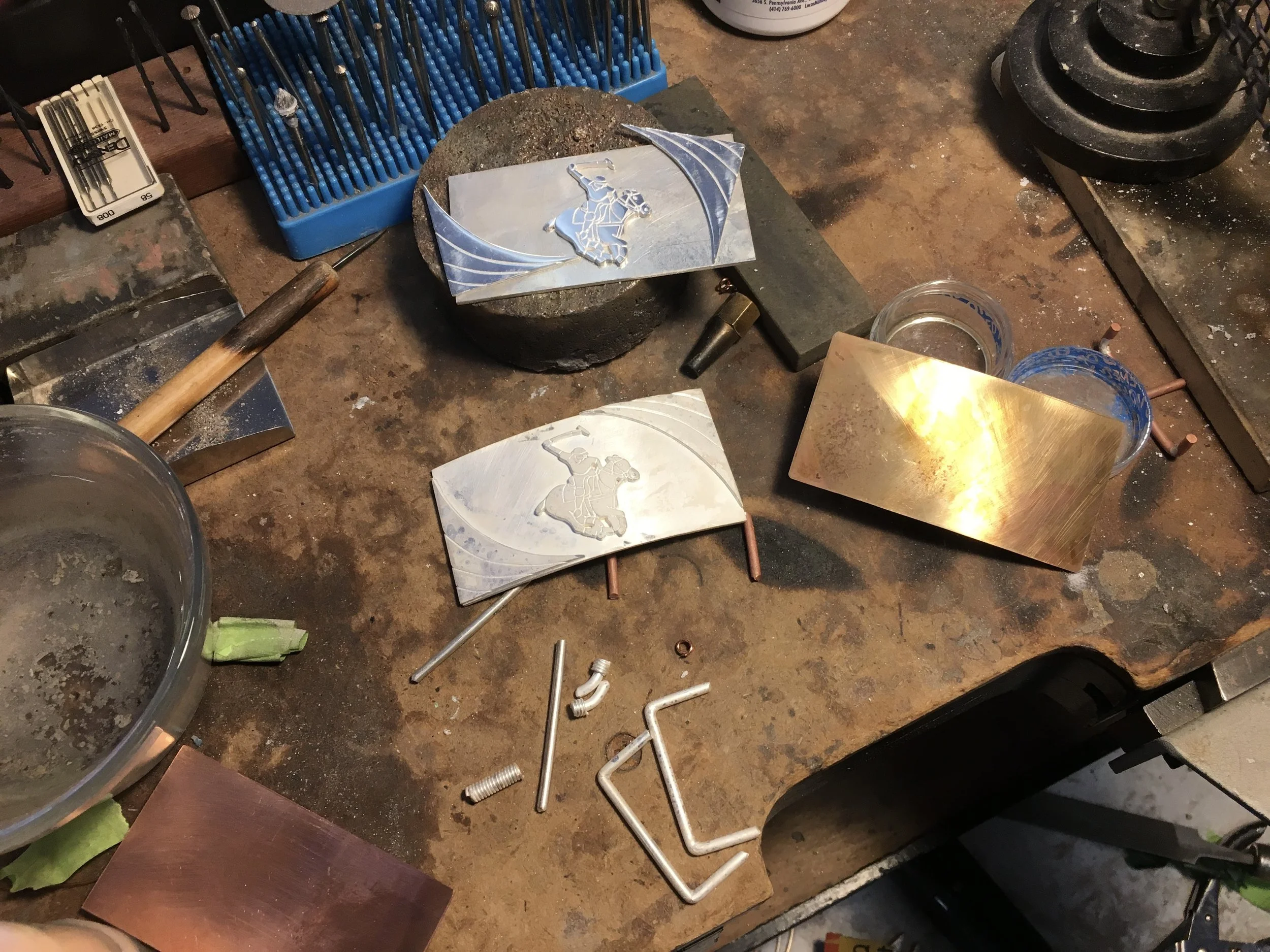 Sacramento based Stark Jewelers designed and crafted polo belt buckle pieces made in sterling silver, featuring sharp geometric silhouettes, heavy-gauge textures, and avant-garde structural design for a modern, bold personal style.