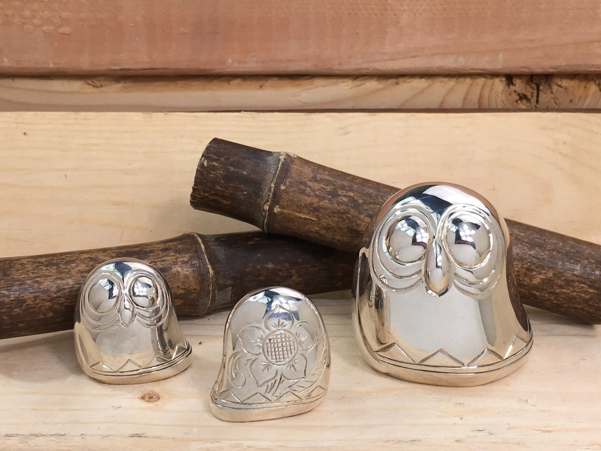 Sterling Silver Owl Family Sculptures
1 Large owl: 2.5in by 2.5in
2 Small owls: 1.5in by 1.5in

Discover our enchanting set of three meticulously crafted sculptures of owls, beautifully fashioned in polished sterling silver. These captivating pieces 