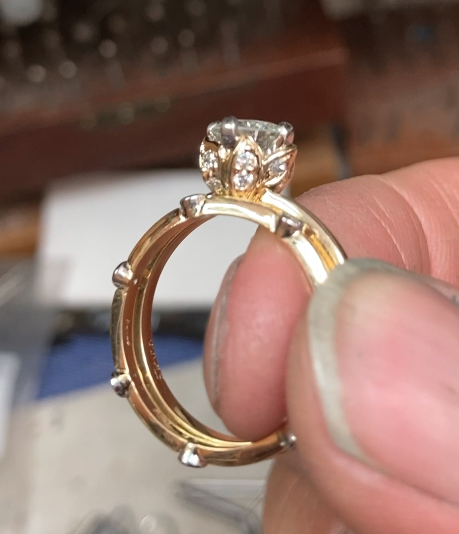 Our master goldsmith, Larry, created a minimalist setting with accent diamonds on the prongs allows the natural diamond to catch the light from every angle