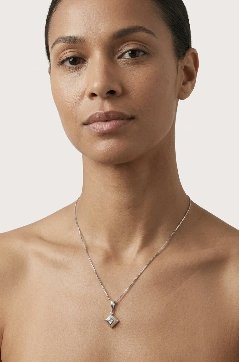 For one daughter, we created a minimalist, elegant single-pyramid pendant. The pendant is designed and handcrafted in Stark Jewelers in Sacramento.
