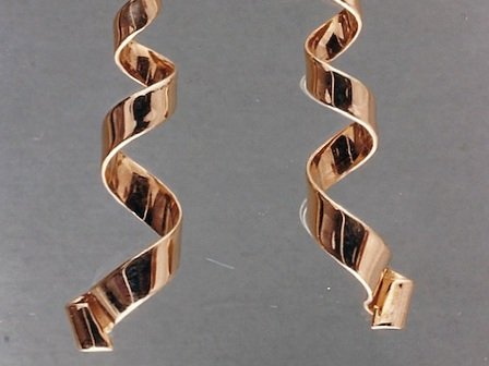 Pair of gold spiral earrings designed and handmade by stark jewelers