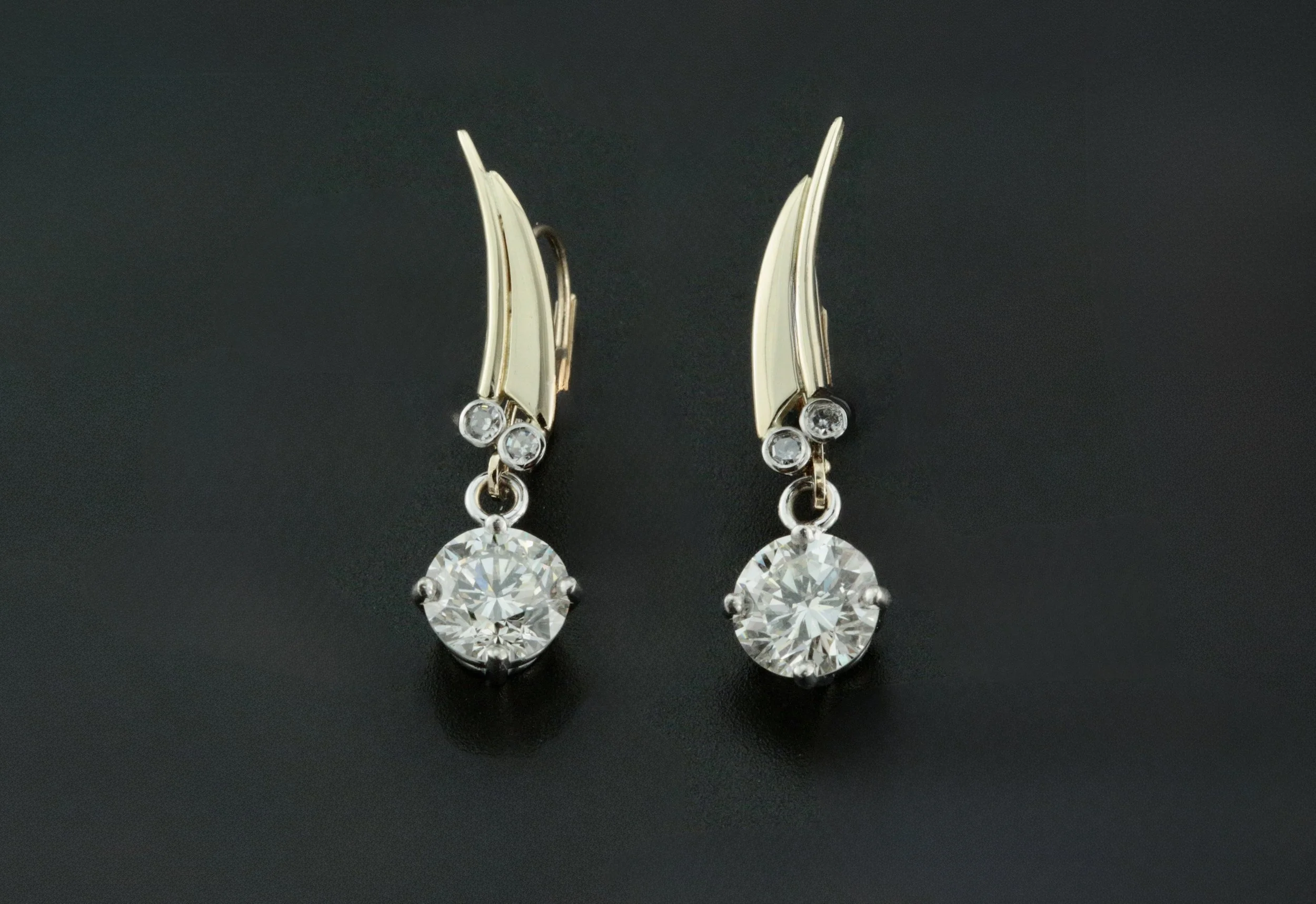 14k yellow gold architectural styling with melee diamonds set in bezels on a redesigned diamond stud earrings