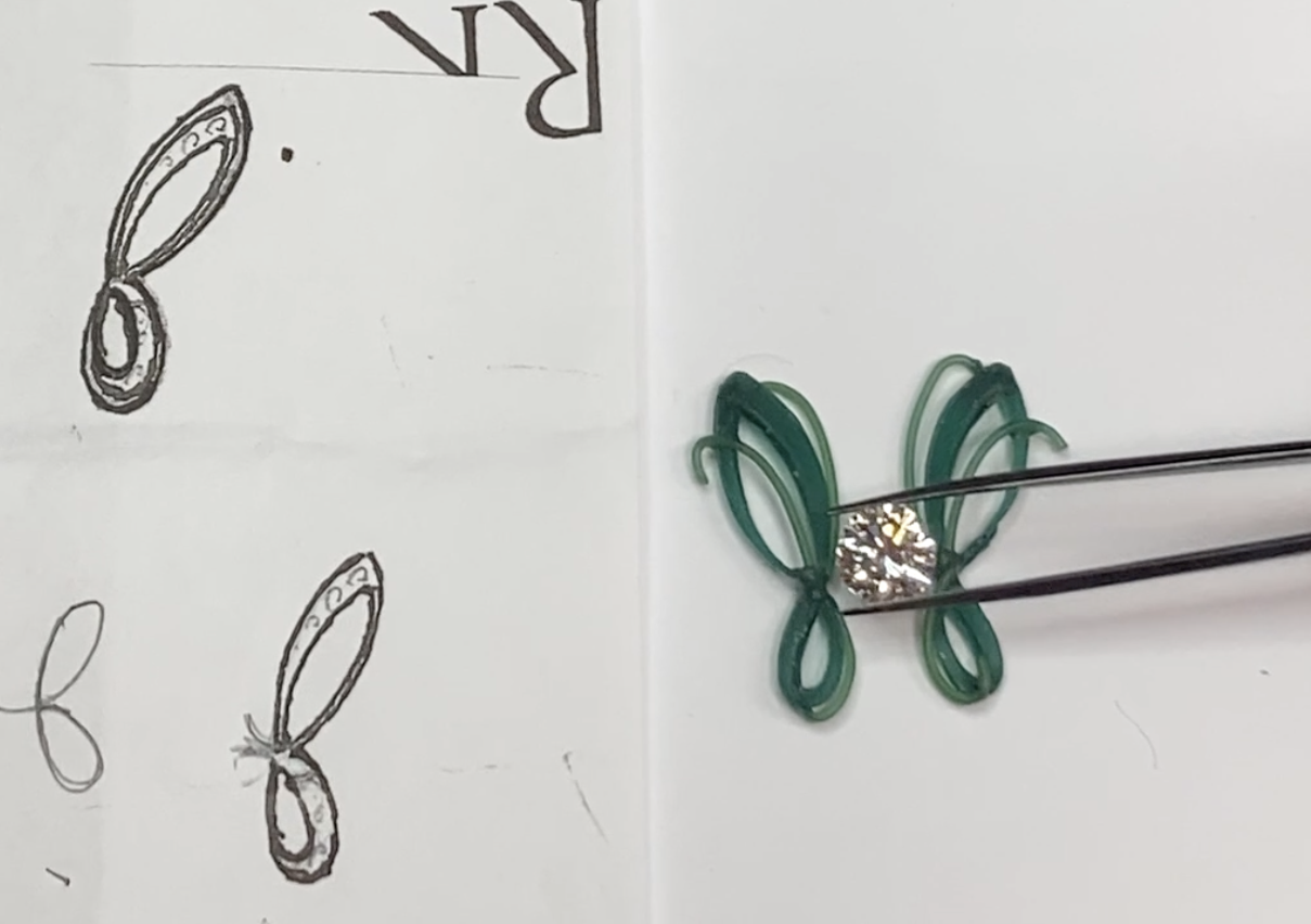 A hand sketch and concept wax made by master goldsmith Larry Stark for a custom pendant in Stark Jewelers, Sacramento