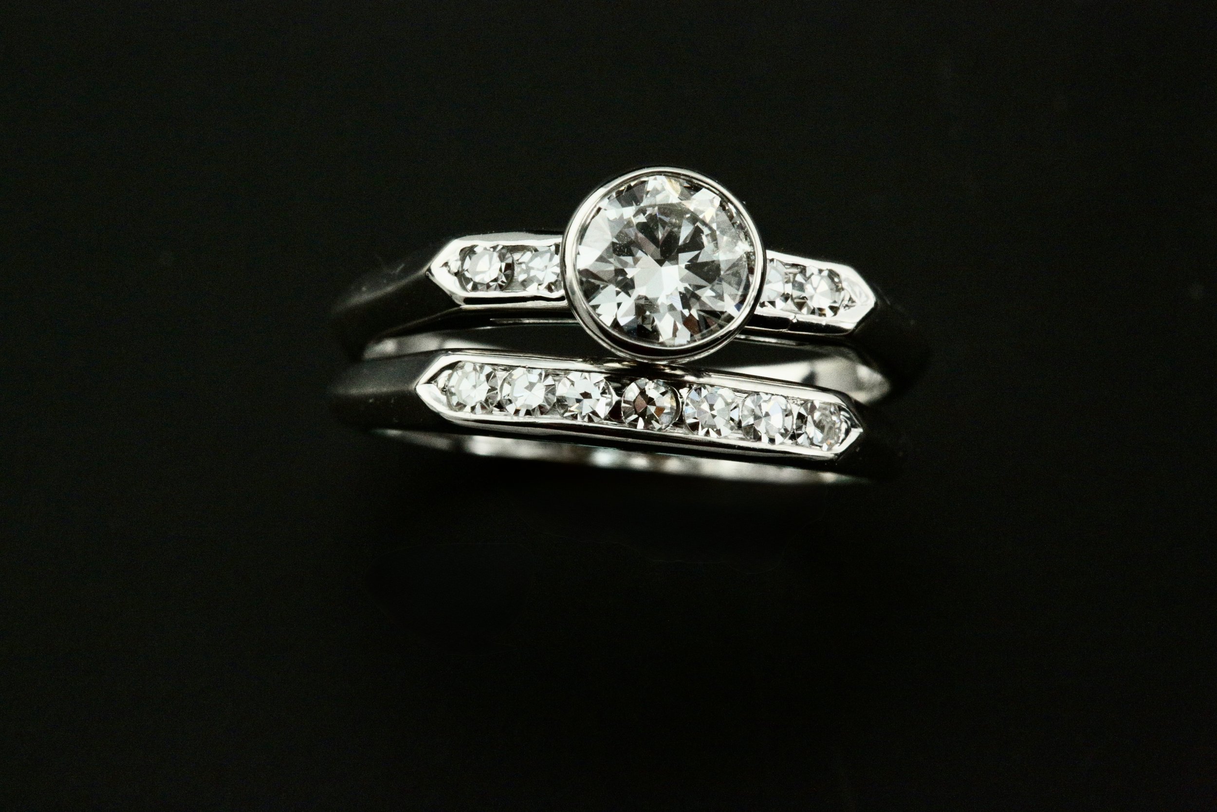 A custom redesigned 14k white gold diamond engagement ring featuring a natural round brilliant diamond set in a bezel at Stark Jewelers located on Fair Oaks Blvd Sacramento