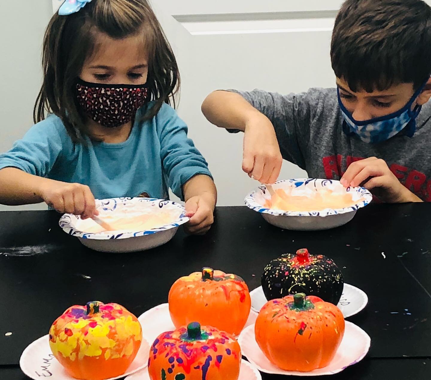 Pumpkin painting and pumpkin slime make for a great day off from school!