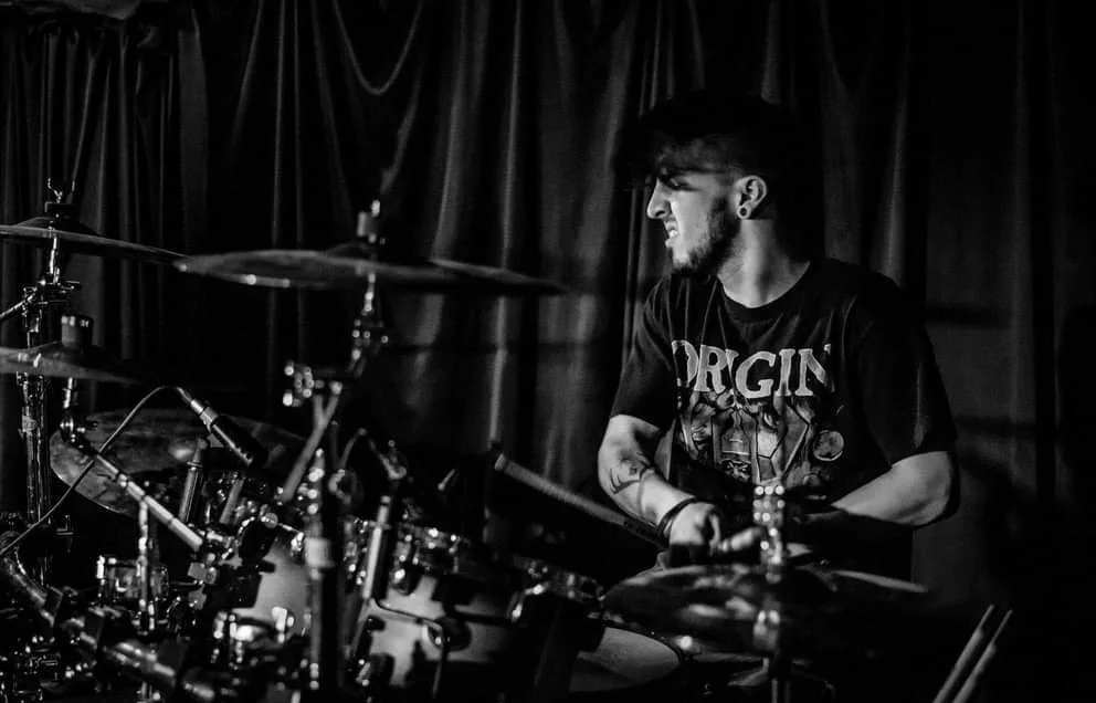 a-teacher-playing a drum