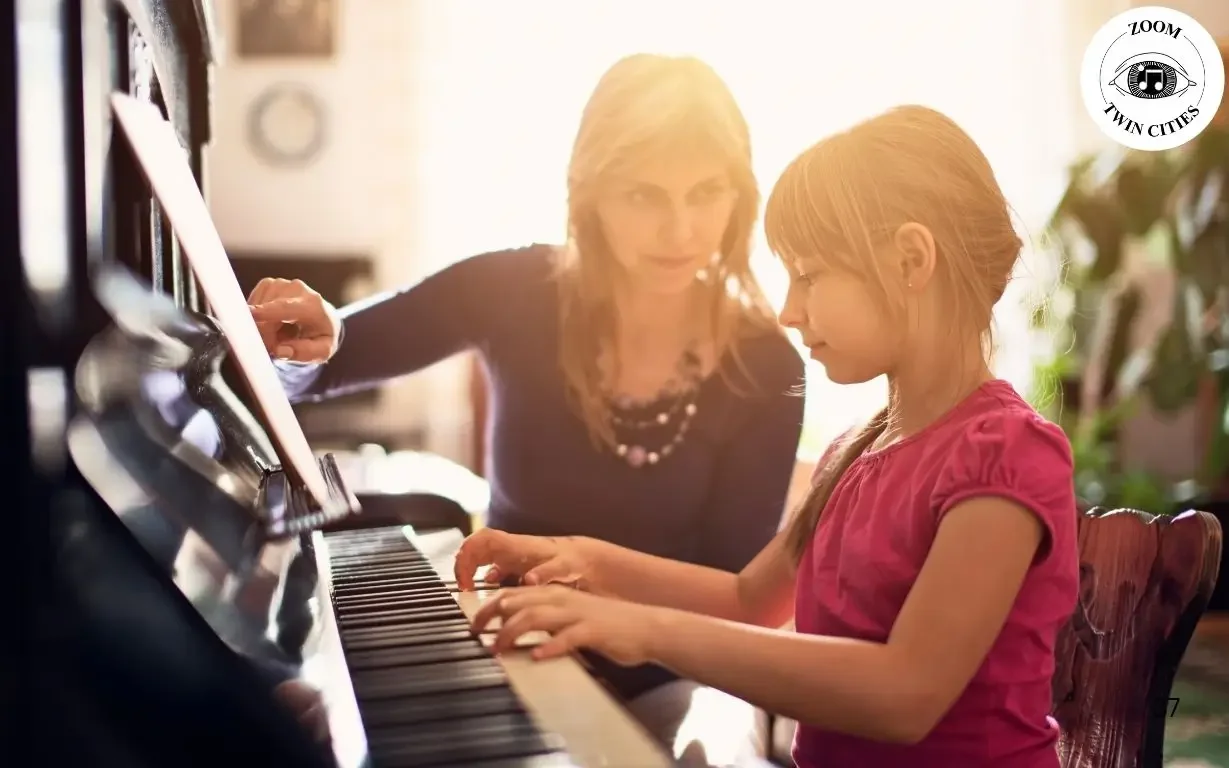 teacher teaching piano to students