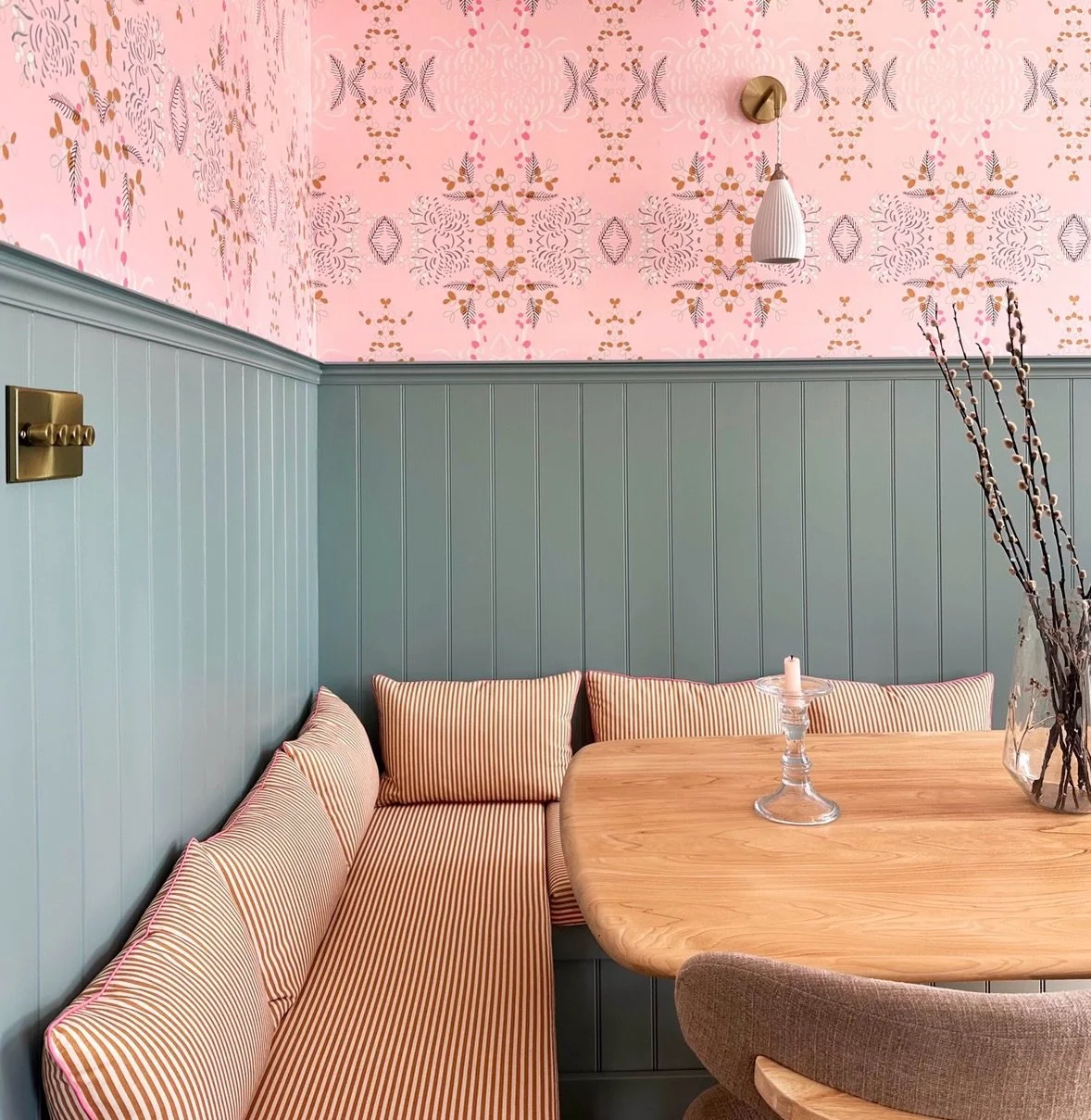 The Before and After of this space that we absolutely LOVE! 

Hubby built the wrap around banquette seating which also has storage underneath (which is a godsend). It is finished with panelling to match the panelling on the wall, and painted in the s