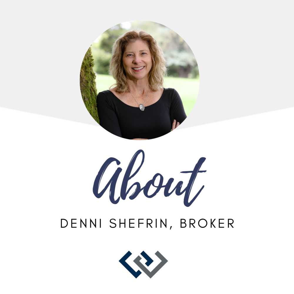 A woman with blonde hair smiling, wearing a black top and a necklace, standing outdoors with a blurred background of greenery.