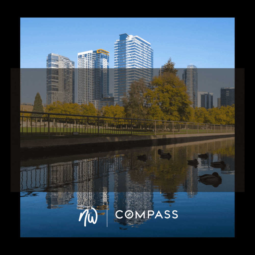 A city skyline with modern high-rise buildings, trees with yellow and green leaves, and a body of water with ducks in the foreground. The sky is clear and blue. The bottom of the image features the text 'NW COMPASS' with a stylized 'NW' logo.