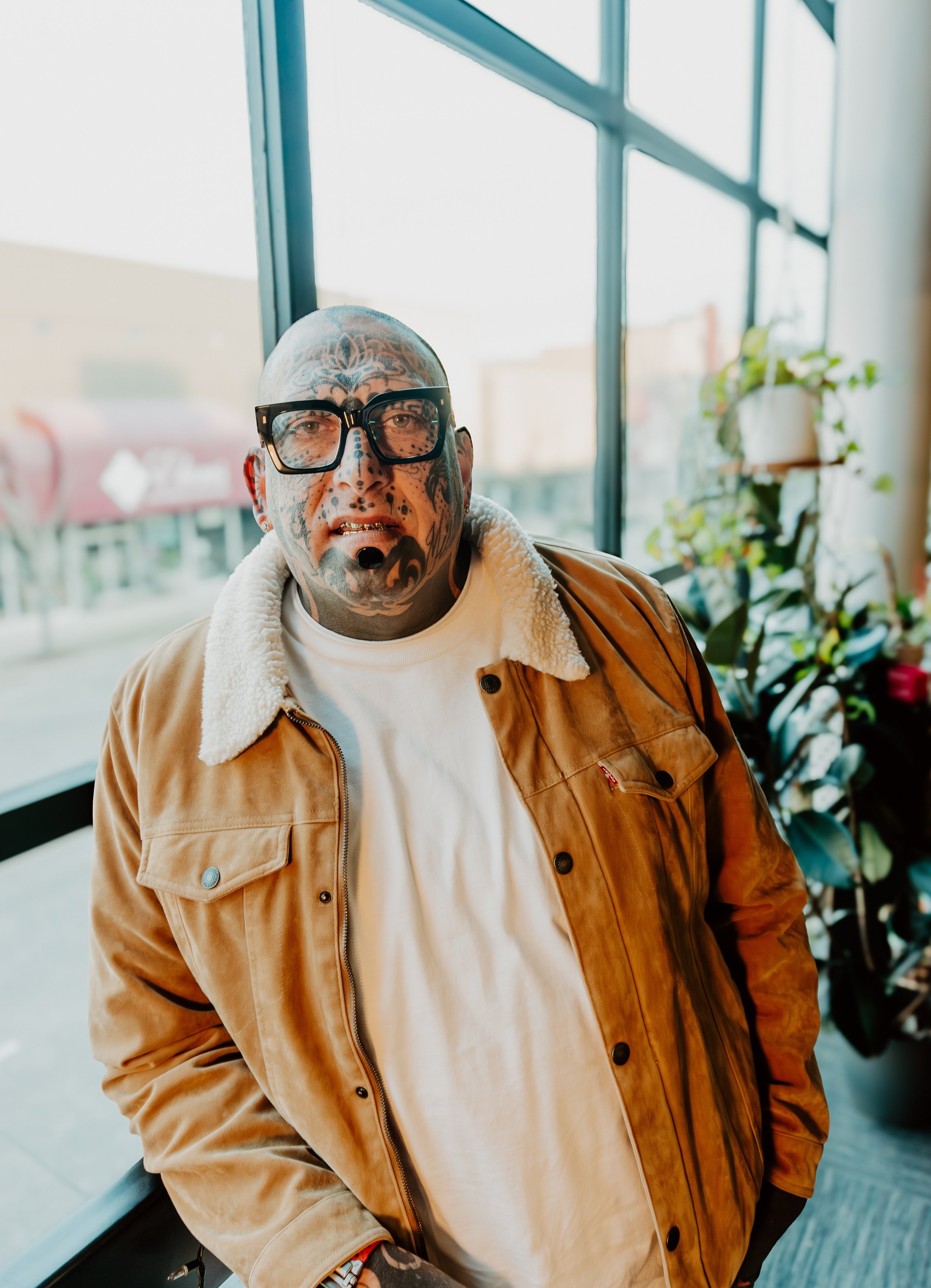 A sky with light blue and gray hues, featuring scattered white clouds.