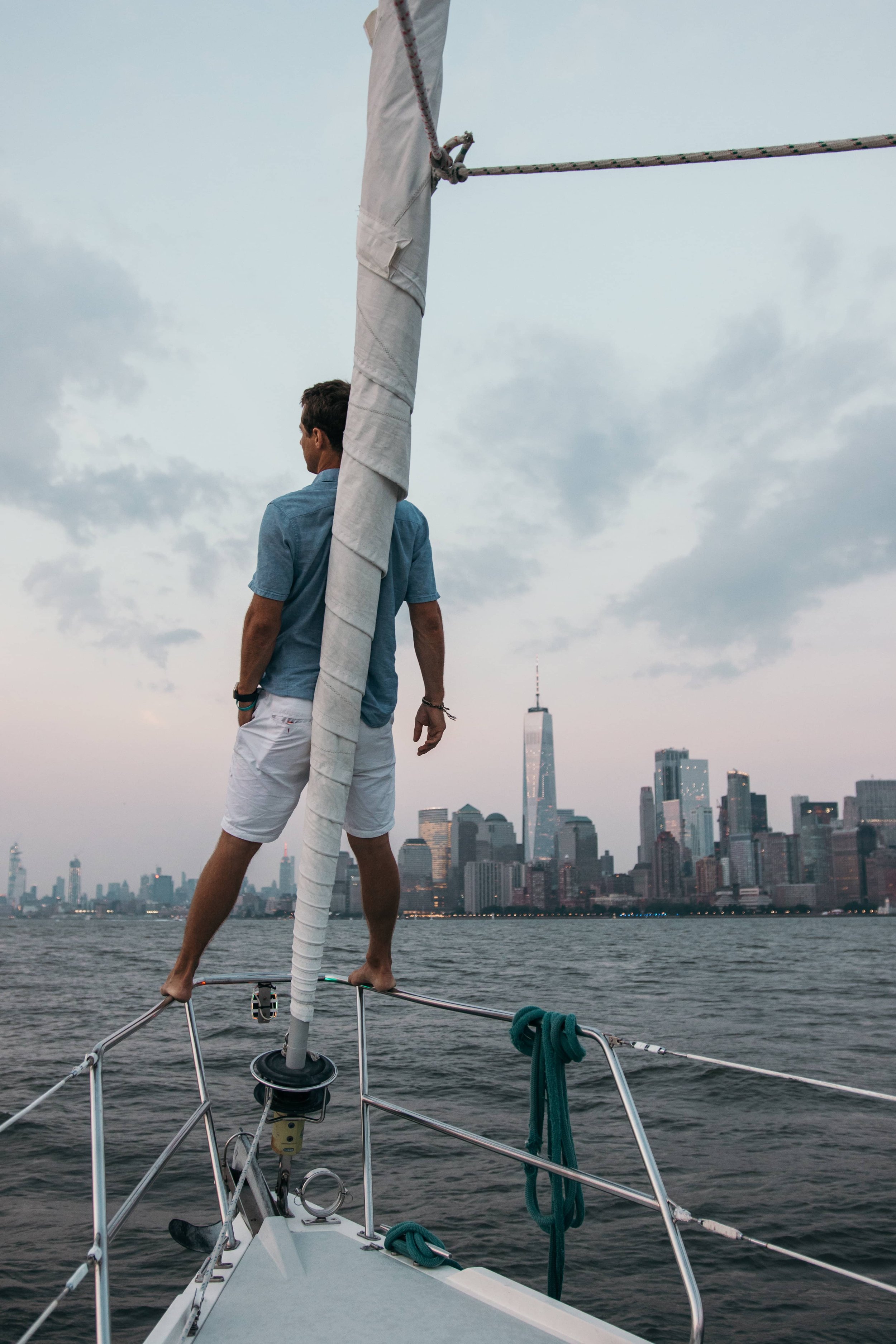Guests enjoying a view of the NYC skyline from a True Sailing charter
