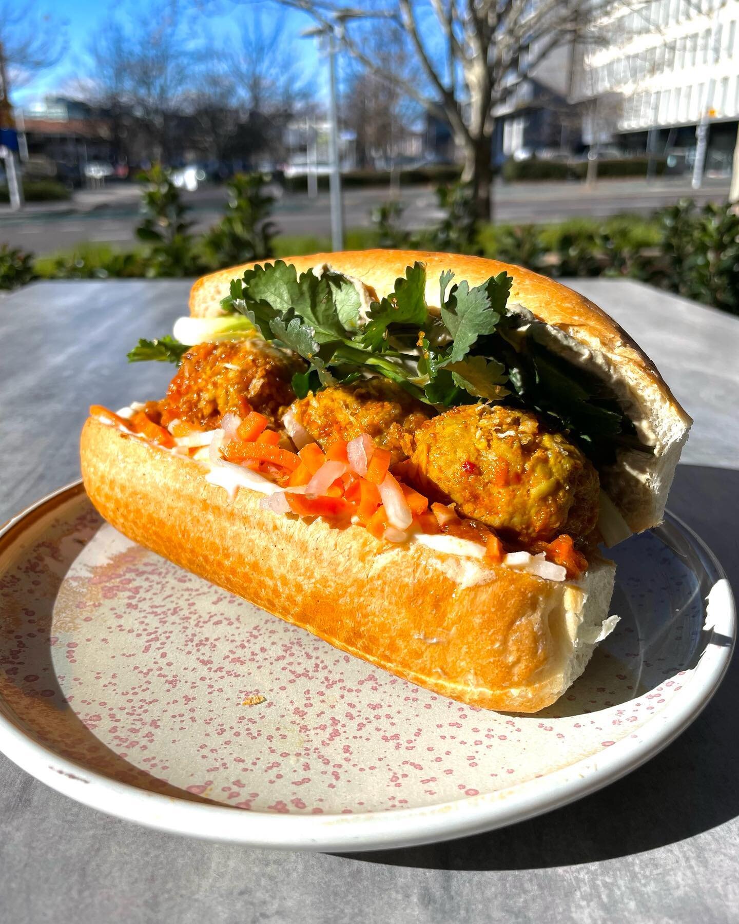 BANH MI XIU MAI

Pork and lemongrass meatballs in tomato sugo, in a banh mi with umami butter, mayo, parfait, pickles, herbs and fried garlic. Available for takeaway at lunch this week (until sold out).
