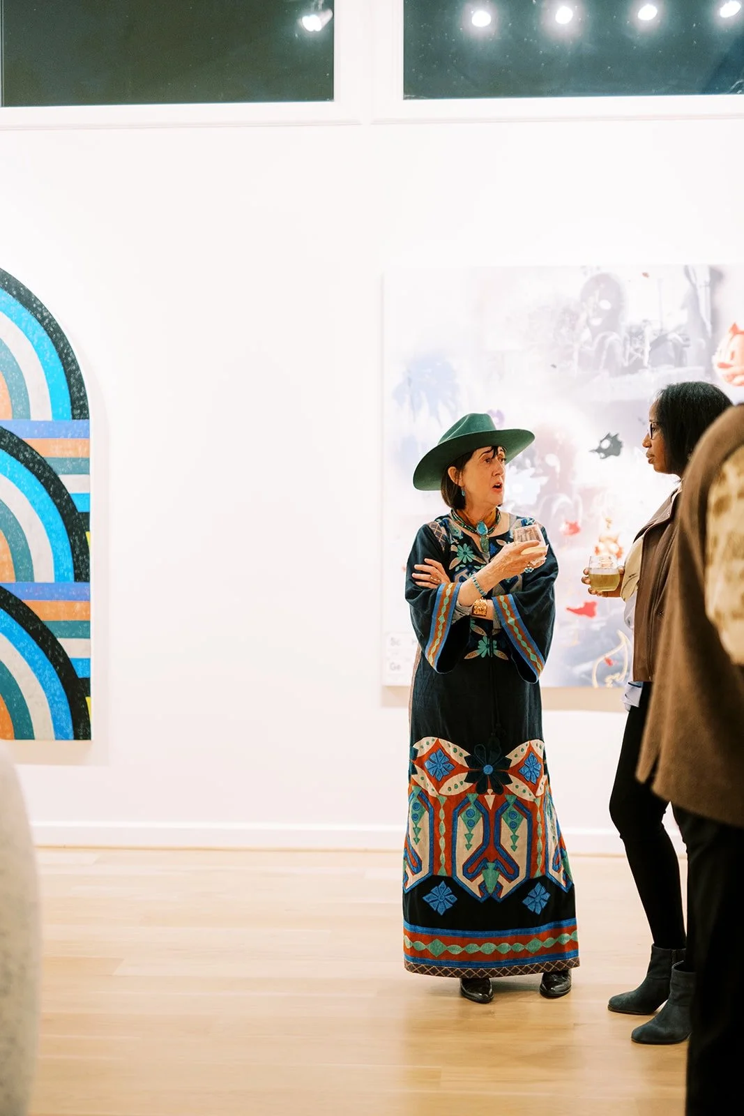 Guests networking at private art gallery corporate event by austin event planners epoch co