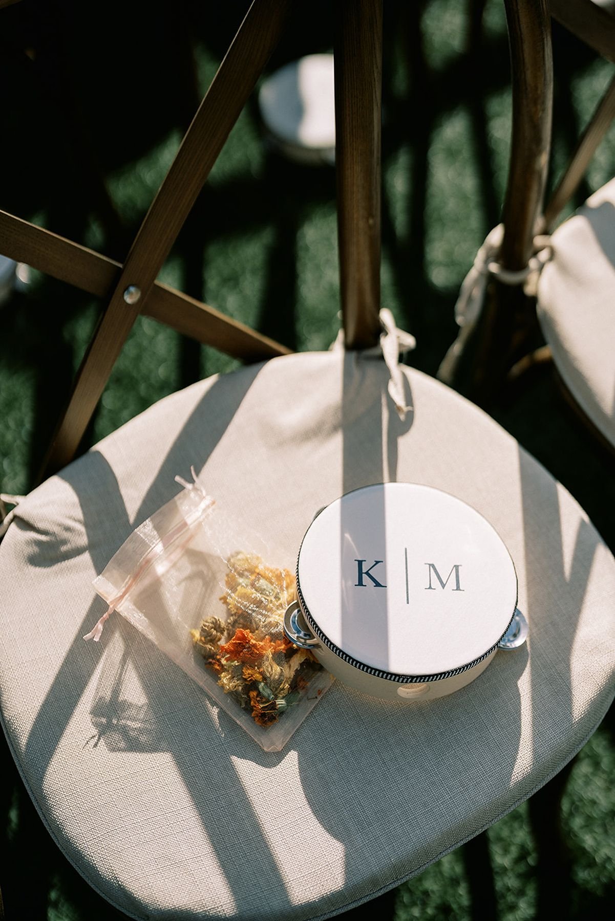  ceremony tambourine and dried flowers for tossing for hindu fusion wedding at The Arlo wedding venue north of austin tx 