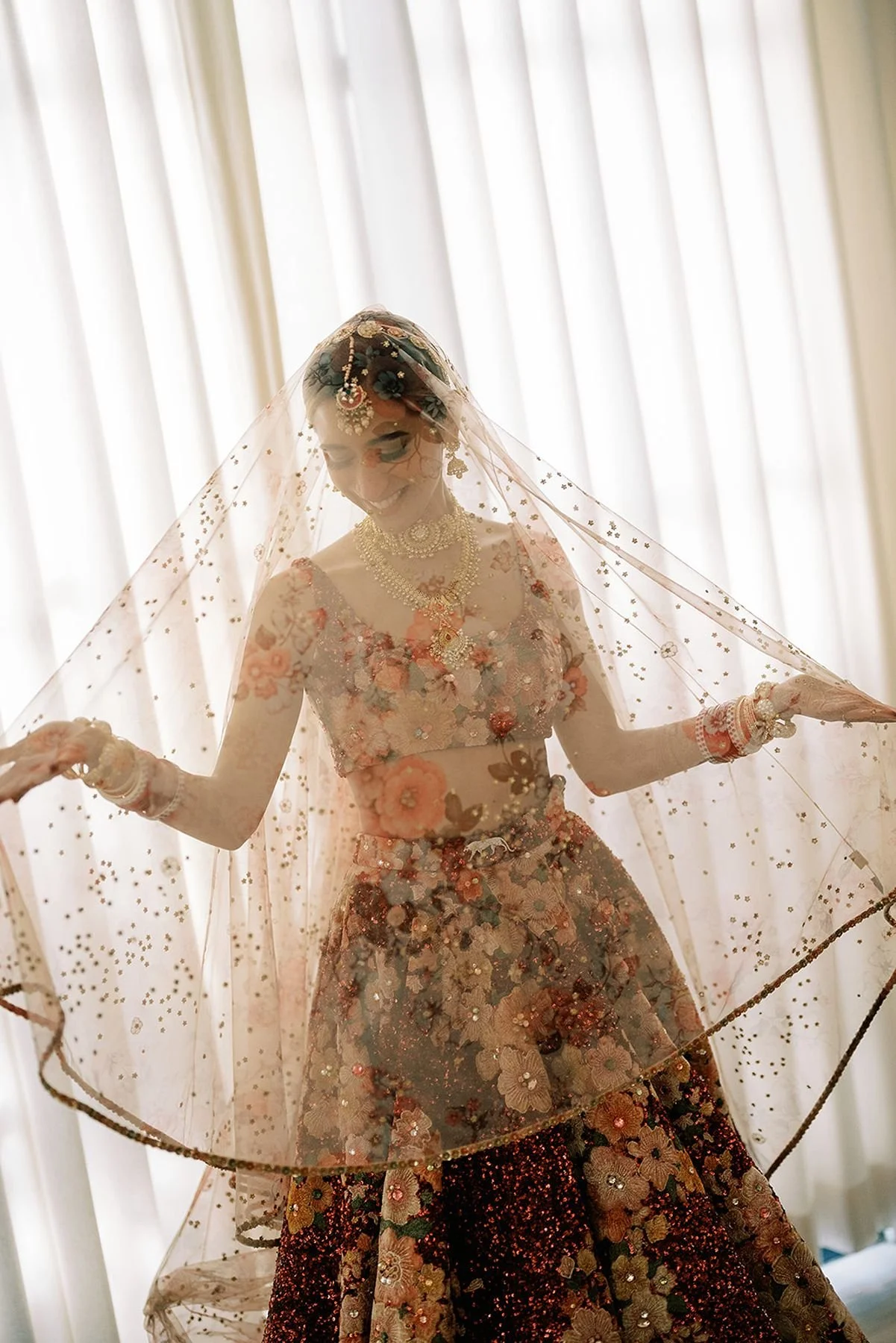 Indian Bride in red traditional dress by Sabyasachi - film bridal portrait by The Brothers Marten - houston wedding planners austin tx 
