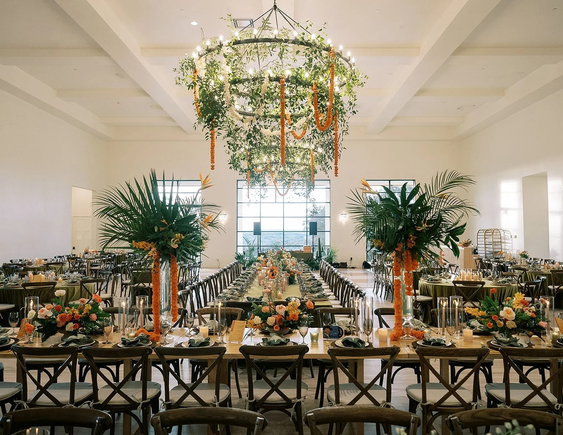 Wide room shot at the arlo wedding venue north of austin with tropical, marigold, and modern design - green, marigold, yellow and blush colors for Hindu fusion wedding for 250 guests by houston wedding planners austin tx