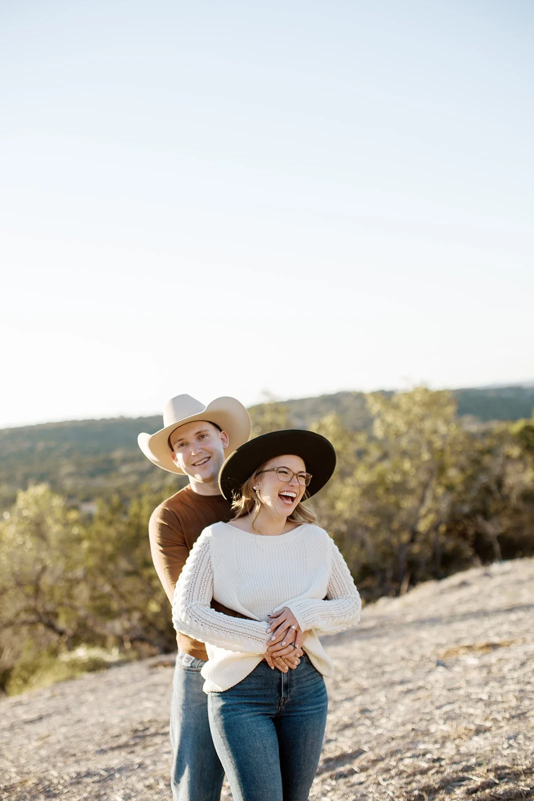 Our Oklahoma wedding planner, Ashley, with her husband laughing in Texas