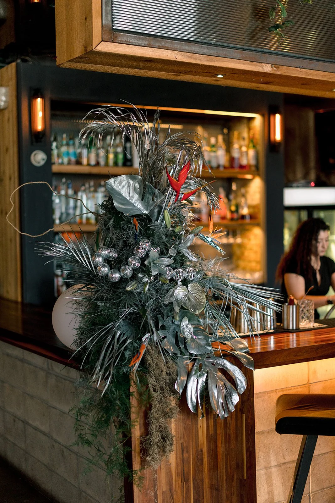 Silver statement bar install with disco details, lassos and tropical florals for Moonlight Mirage houston networking and educational event