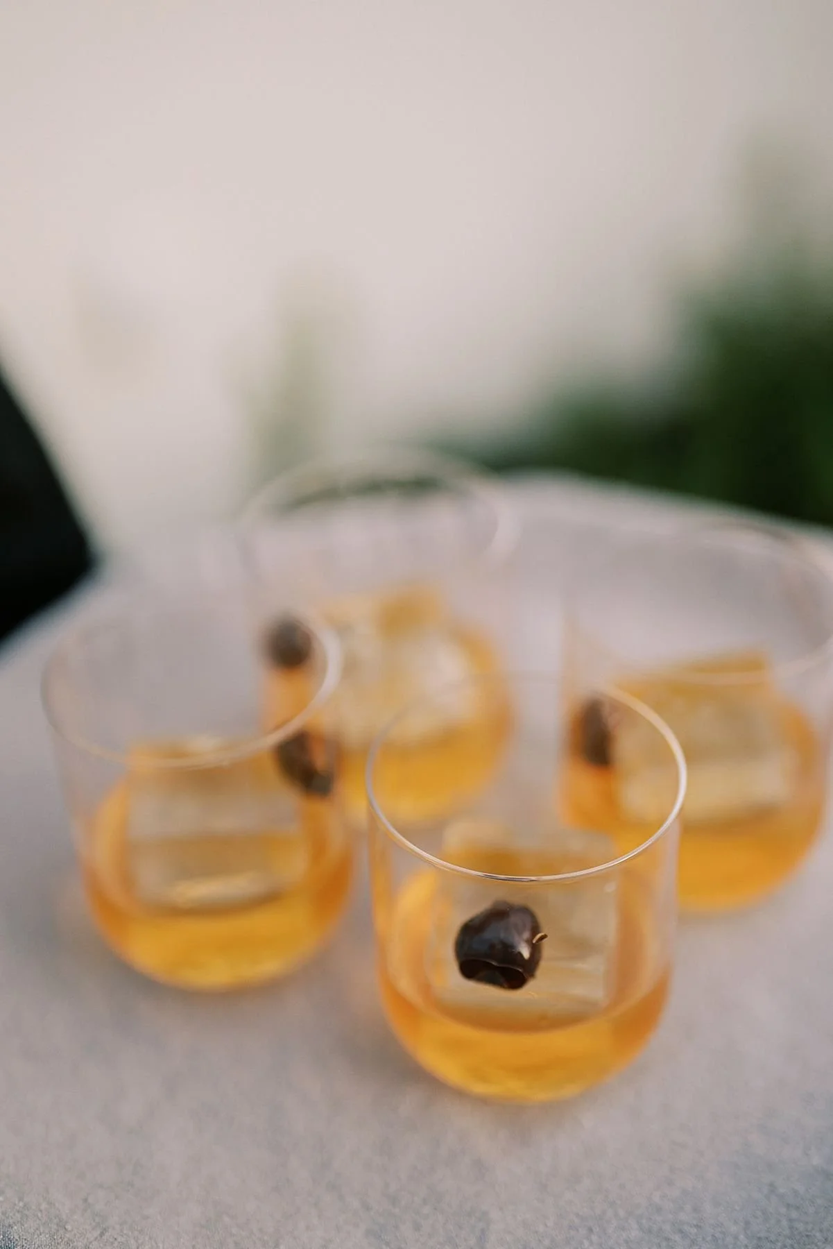 Large ice cubes in old fashion welcome cocktails for custom gastronomy and hospitality focused wedding weekend by destination wedding planners epoch co in austin tx