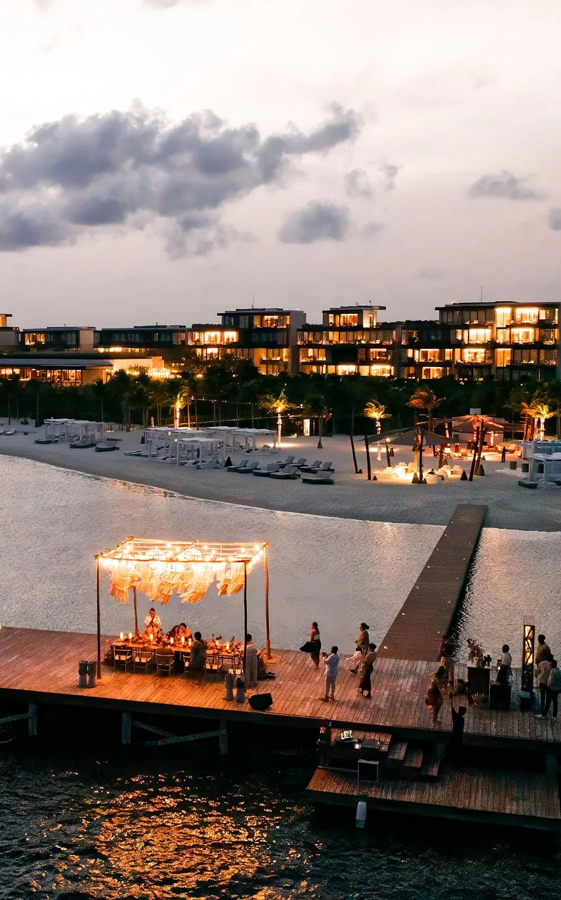 Intimate dinner on the water in mexico destination wedding planner Epoch