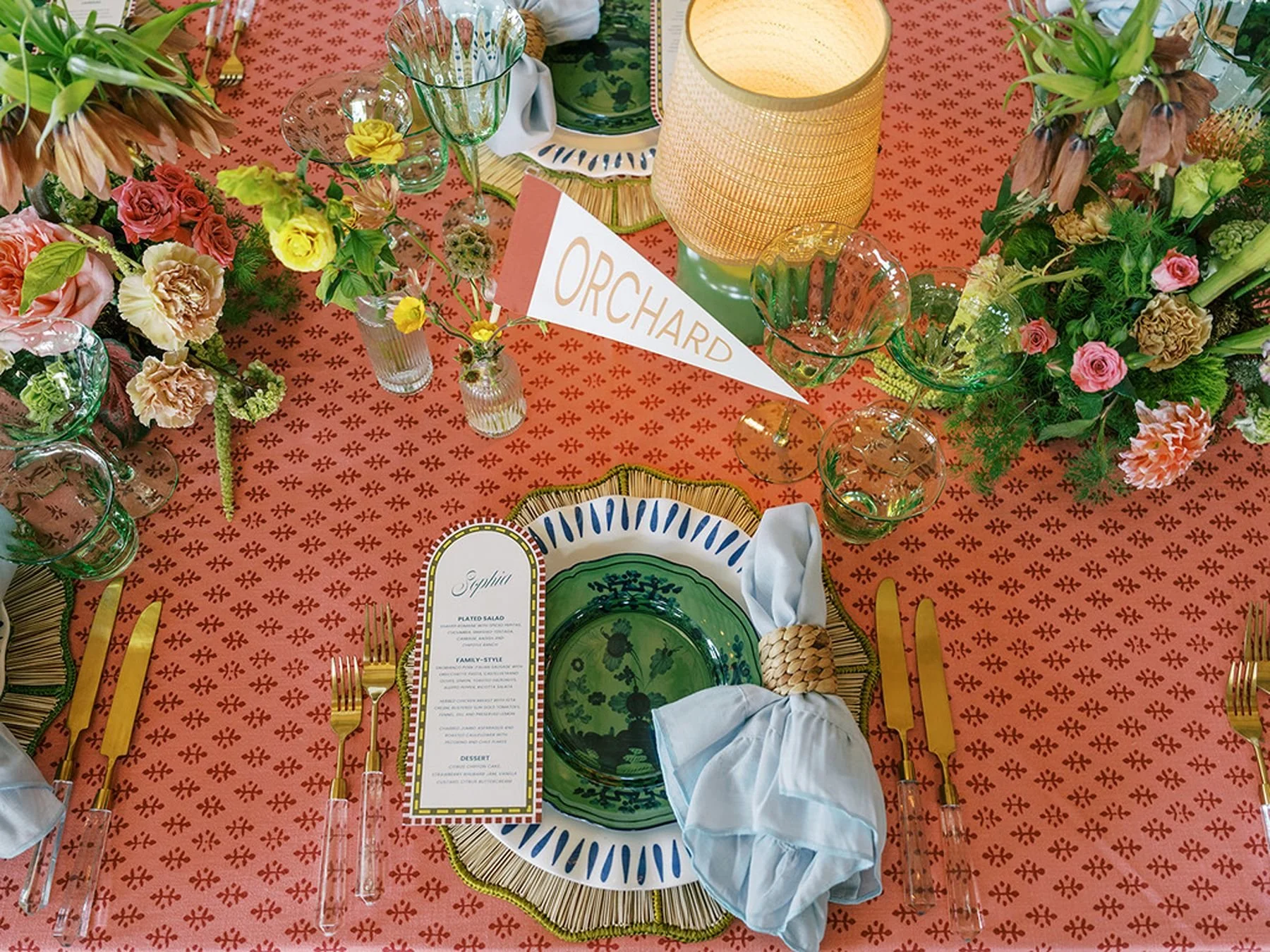 Pink, green, mediterranean inspired tabletop design with chicago cub pennant flag table names