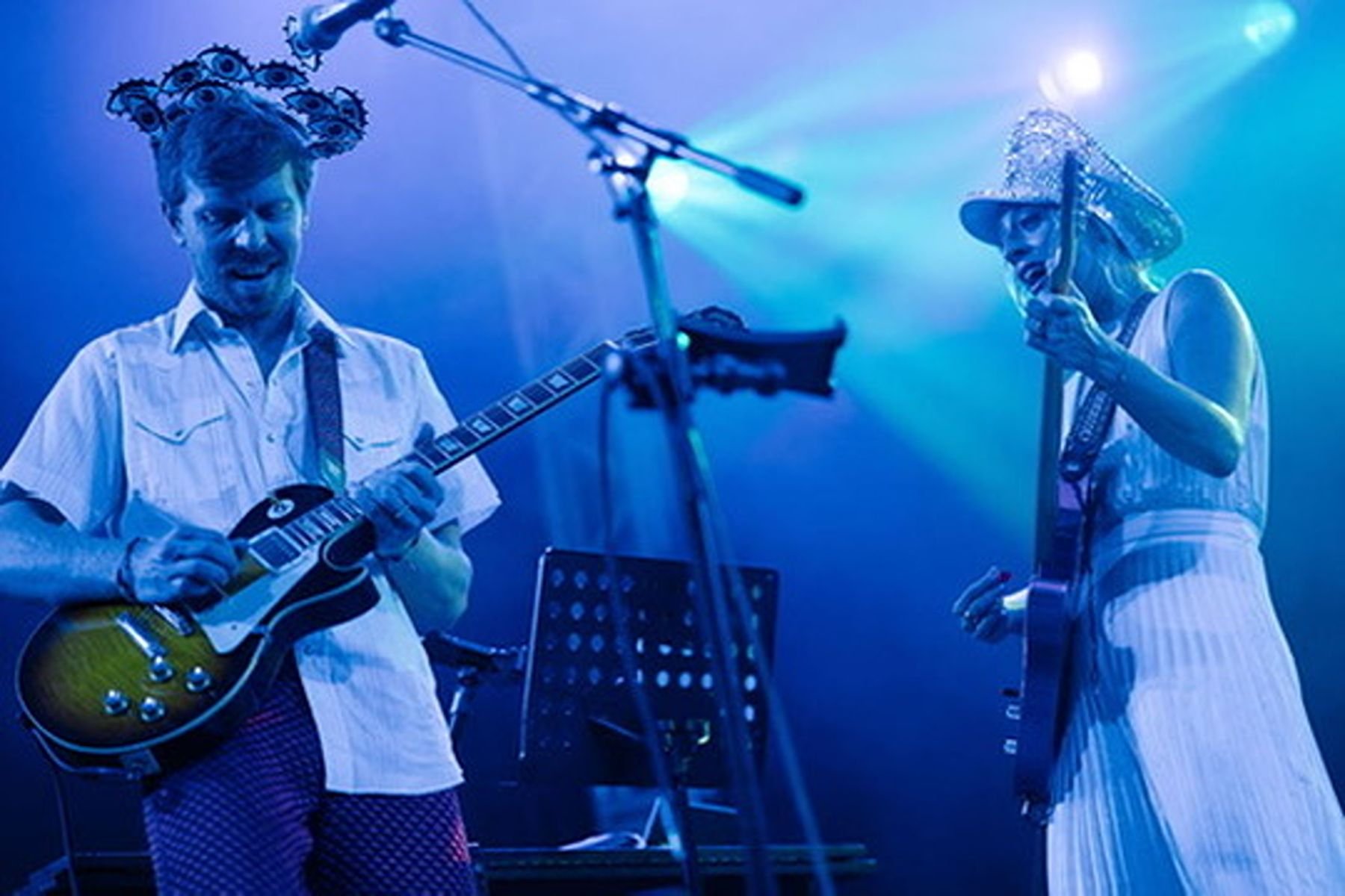 Bride and Groom Playing Instruments on stage at Concert Wedding held at Stubbs and produced by Austin wedding planners Epoch