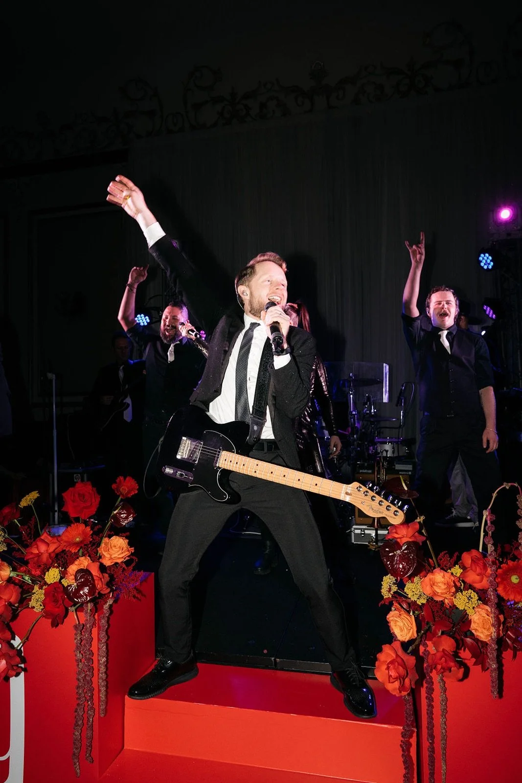 Red-themed corporate gala at Driskill Hotel with live music after party