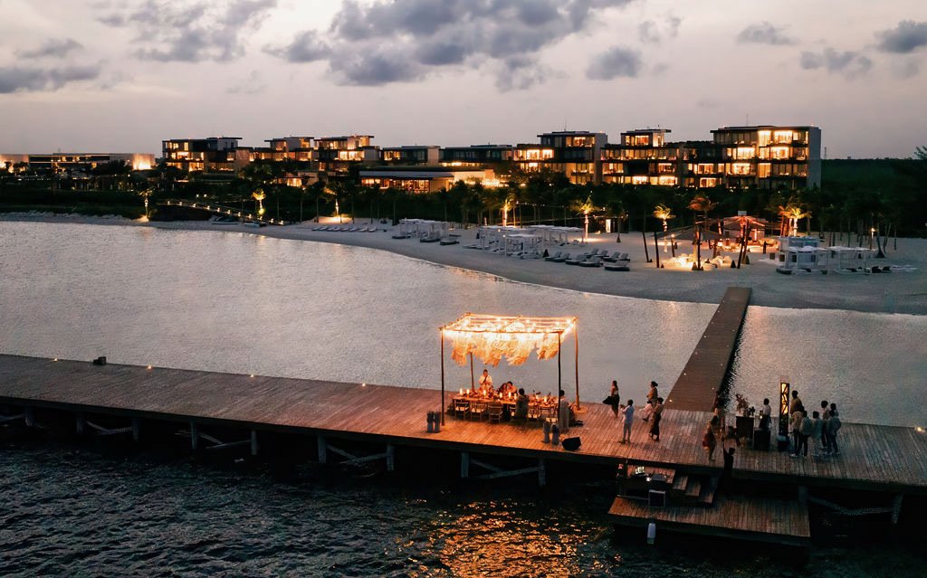 Best wedding planners near me for a destination wedding in Mexico on a dock over the water at Etereo Auberge Riviera Maya