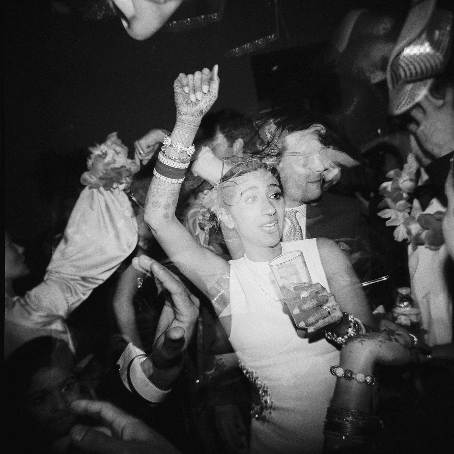 Holga film photo by brothers marten of dance party during wedding reception, black and white, wedding planners and wedding coordinators for fusion wedding