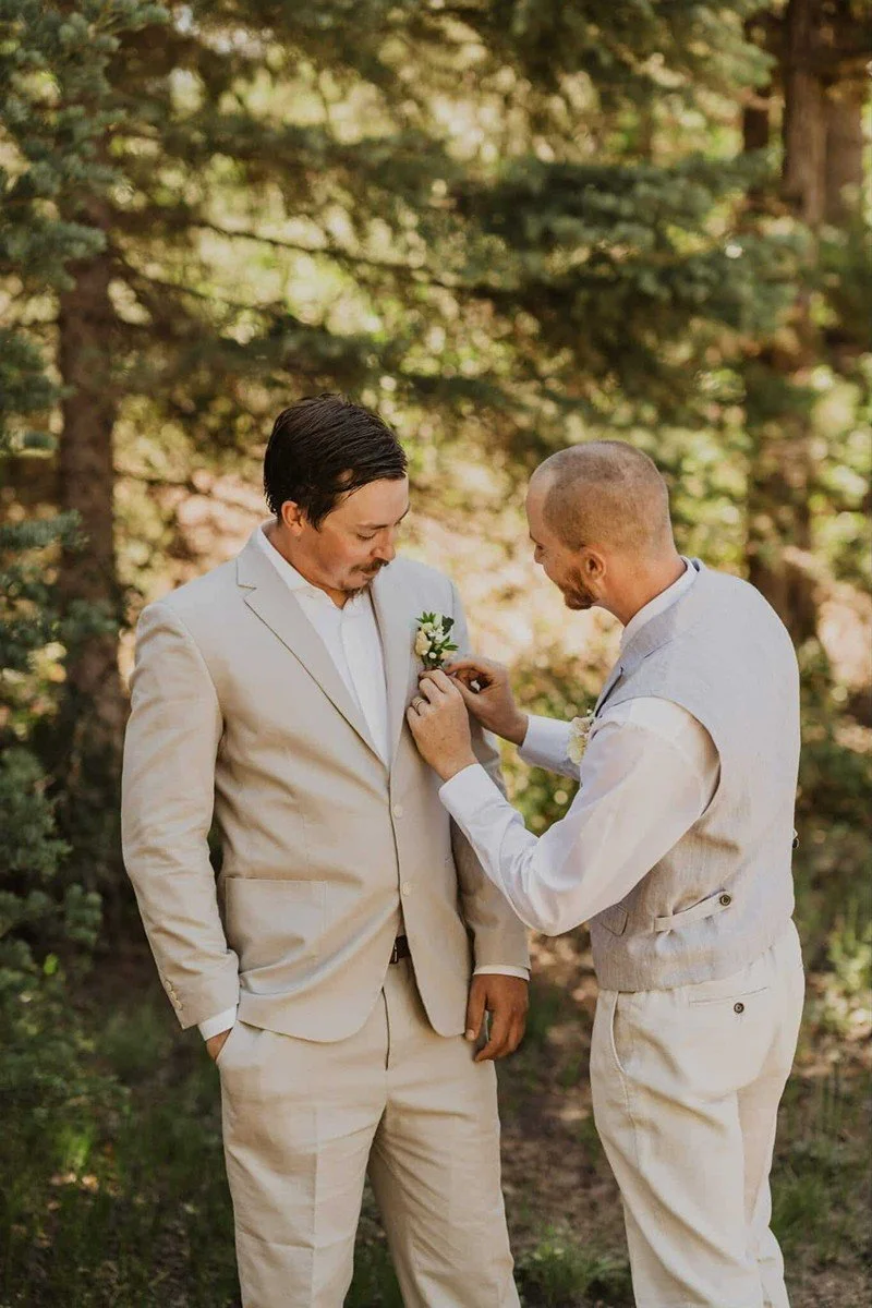pinning-on-groom-boutonniere.jpg