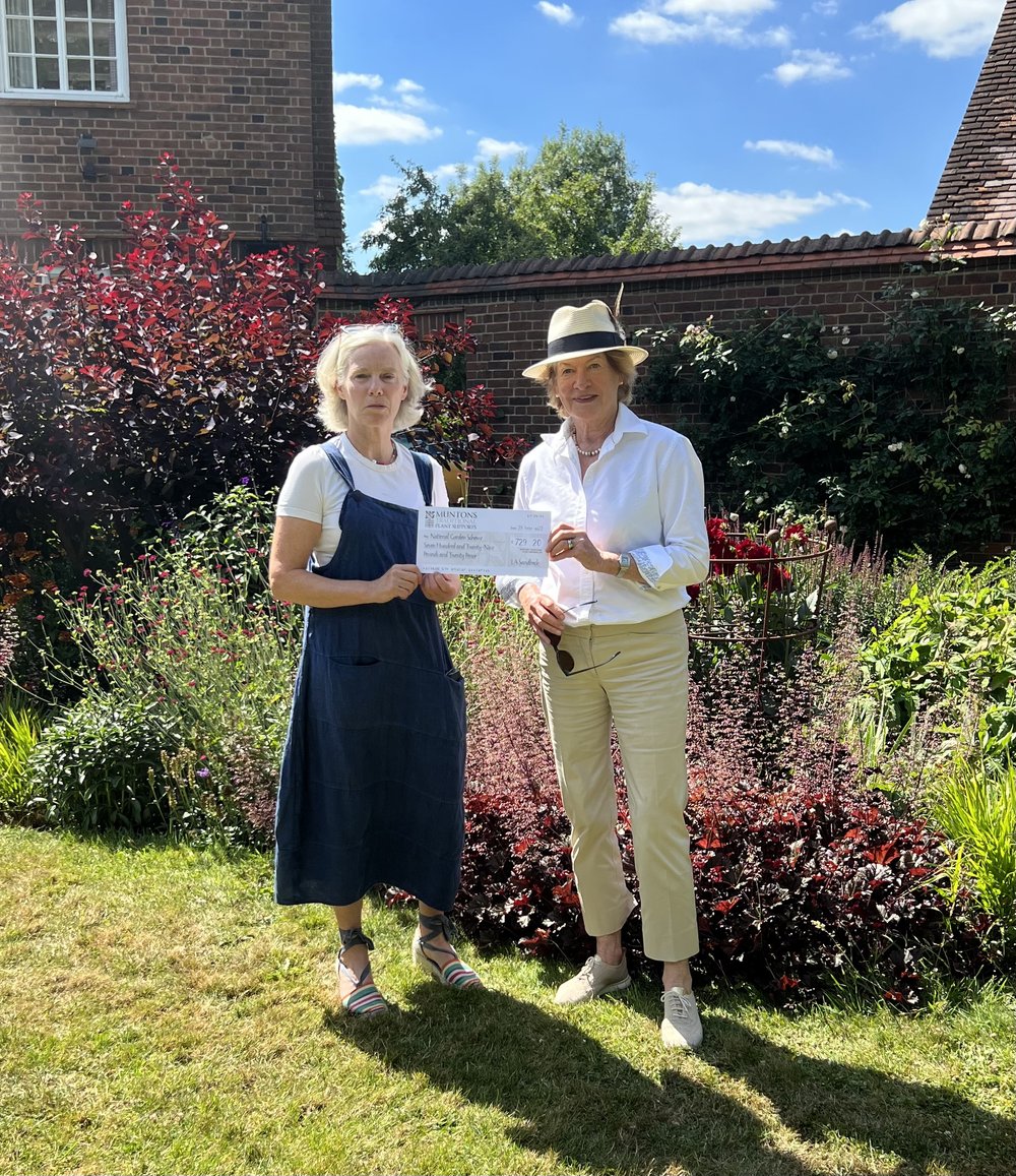 I present Sarah with a cheque for the NGS raised by our sale items
