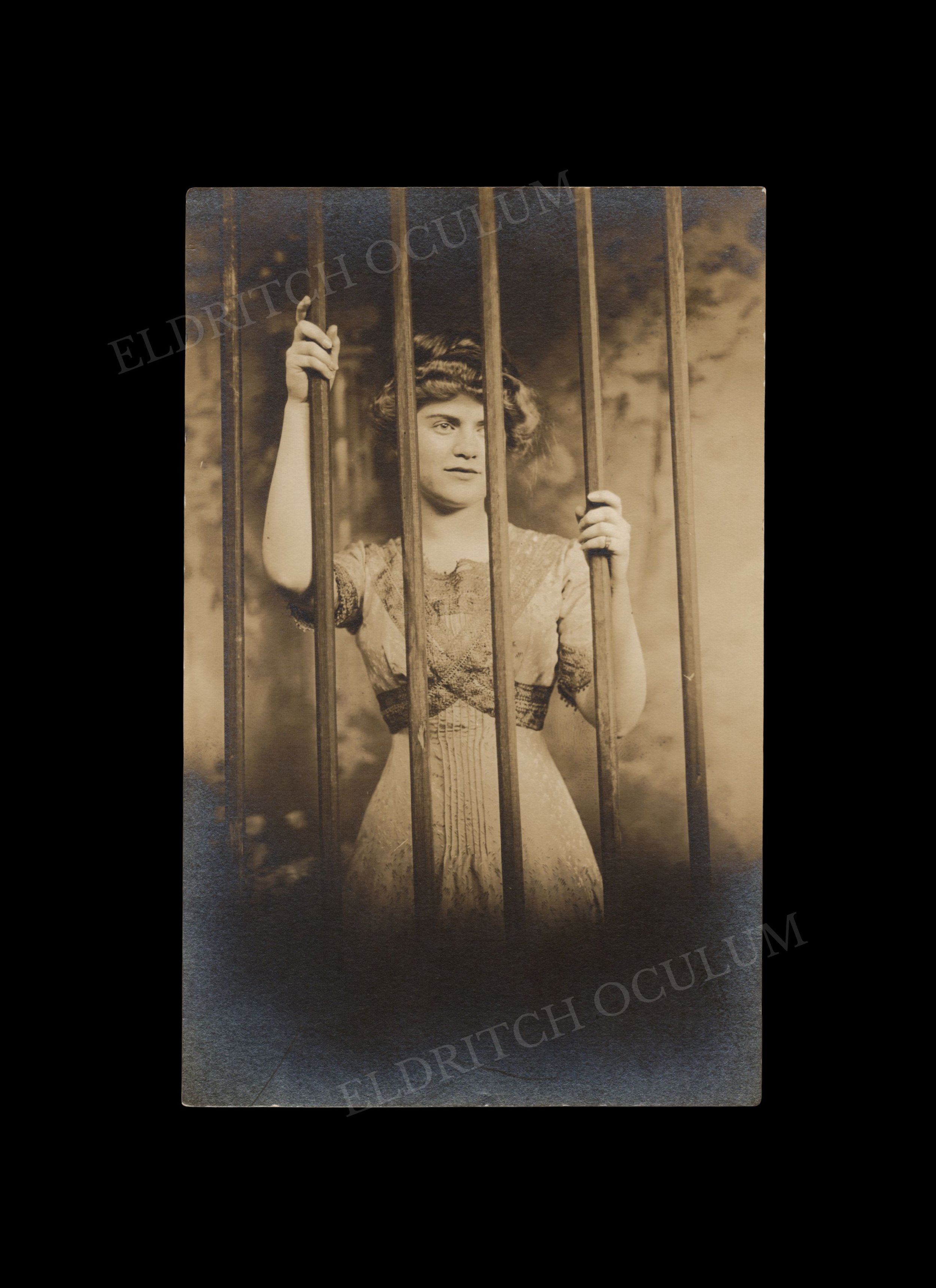 Imprisoned Woman with Masculine Features, real-photo postcard, c. 1910