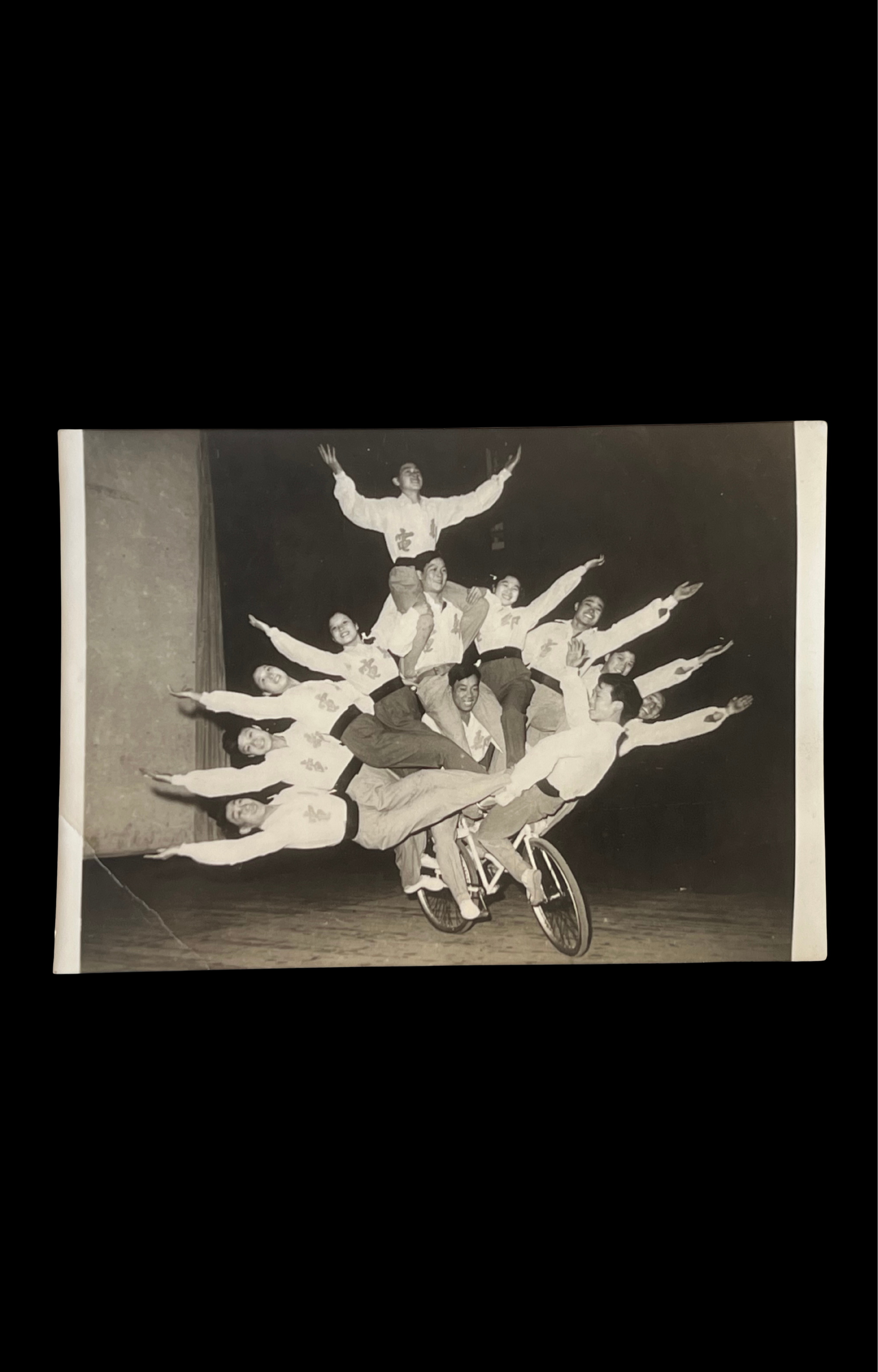 12 Perfromers Riding a Single Bicycle Balancing Act, c. 1940