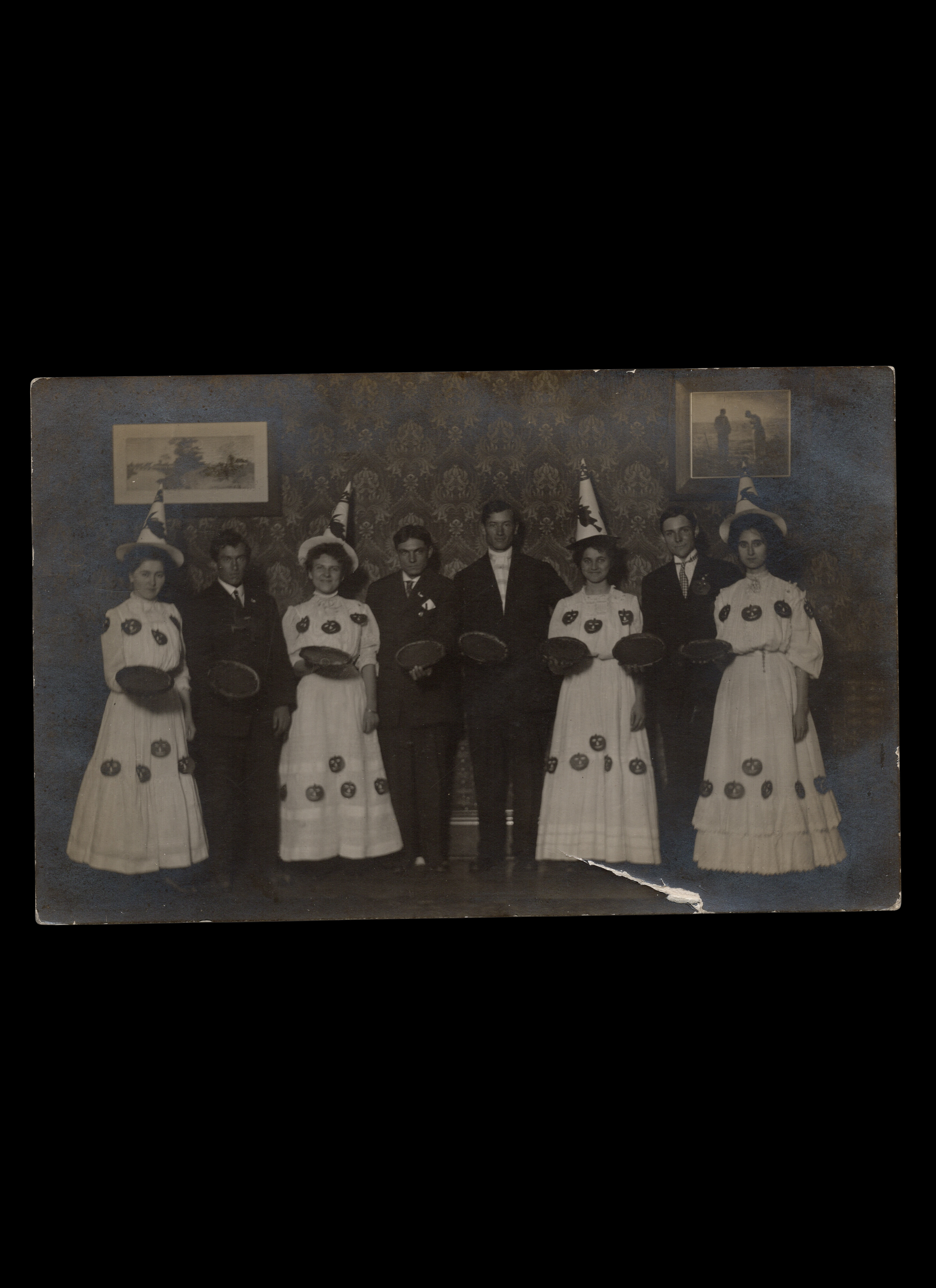 Halloween Banquet with Group Presenting Pumpkin Pies, Real-Photo Postcard, c. 1908