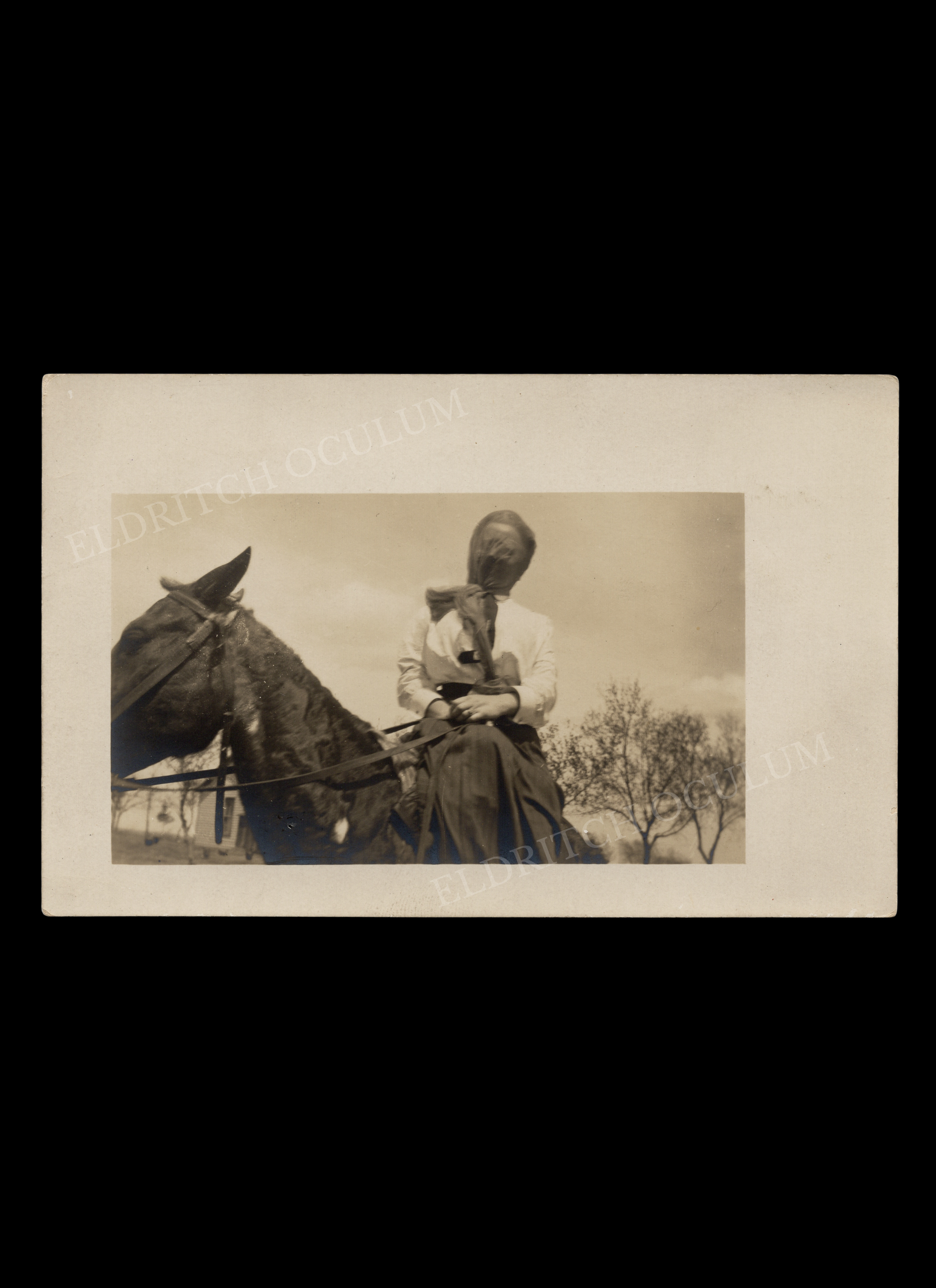 Woman Sitting Sidesaddle with Entire Head Veiled, real-photo postcard, c. 1910