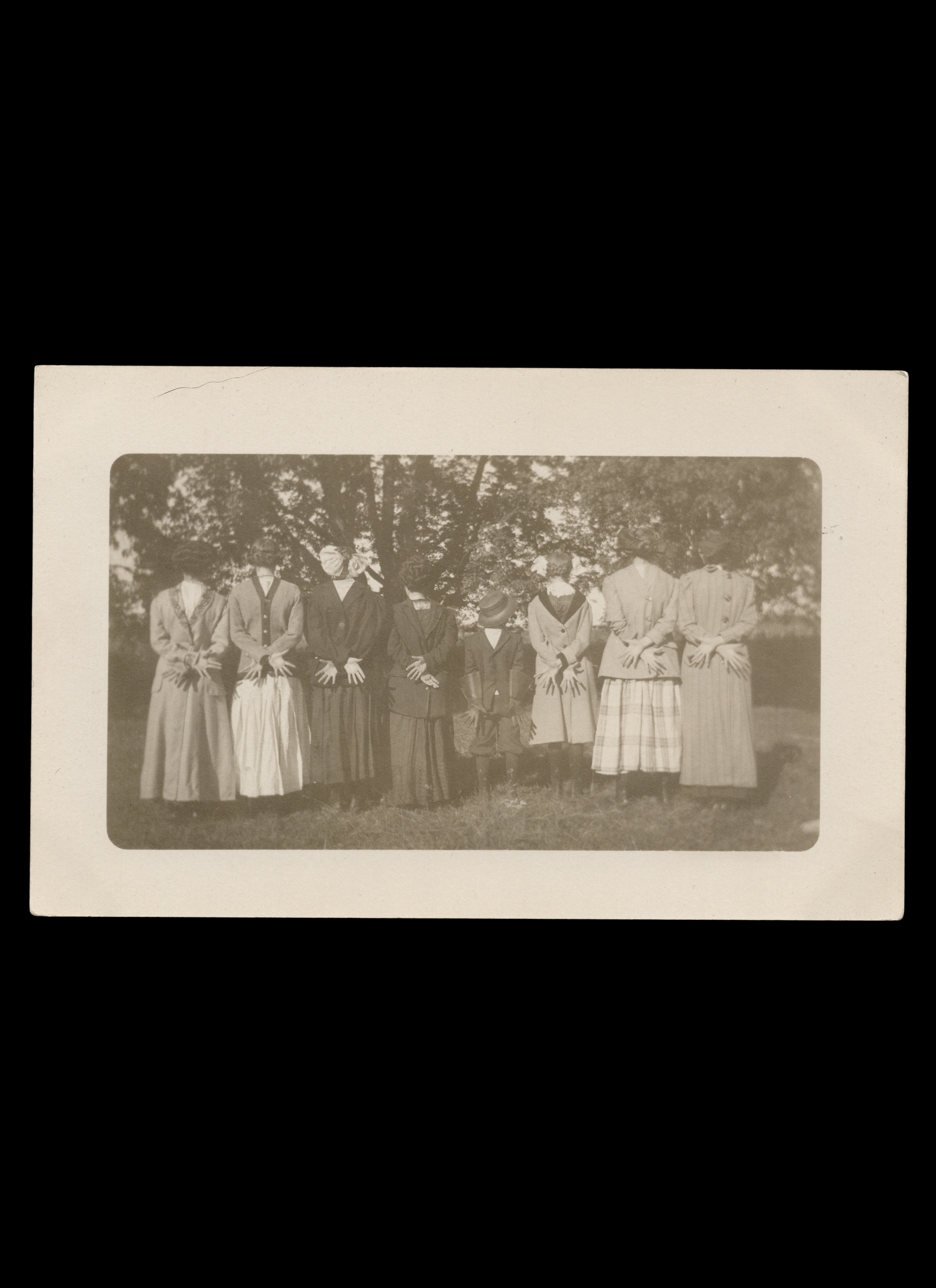 Back-to-Camera Group Portrait Wearing Clothing Backwards, Real-Photo Postcard, c. 1910