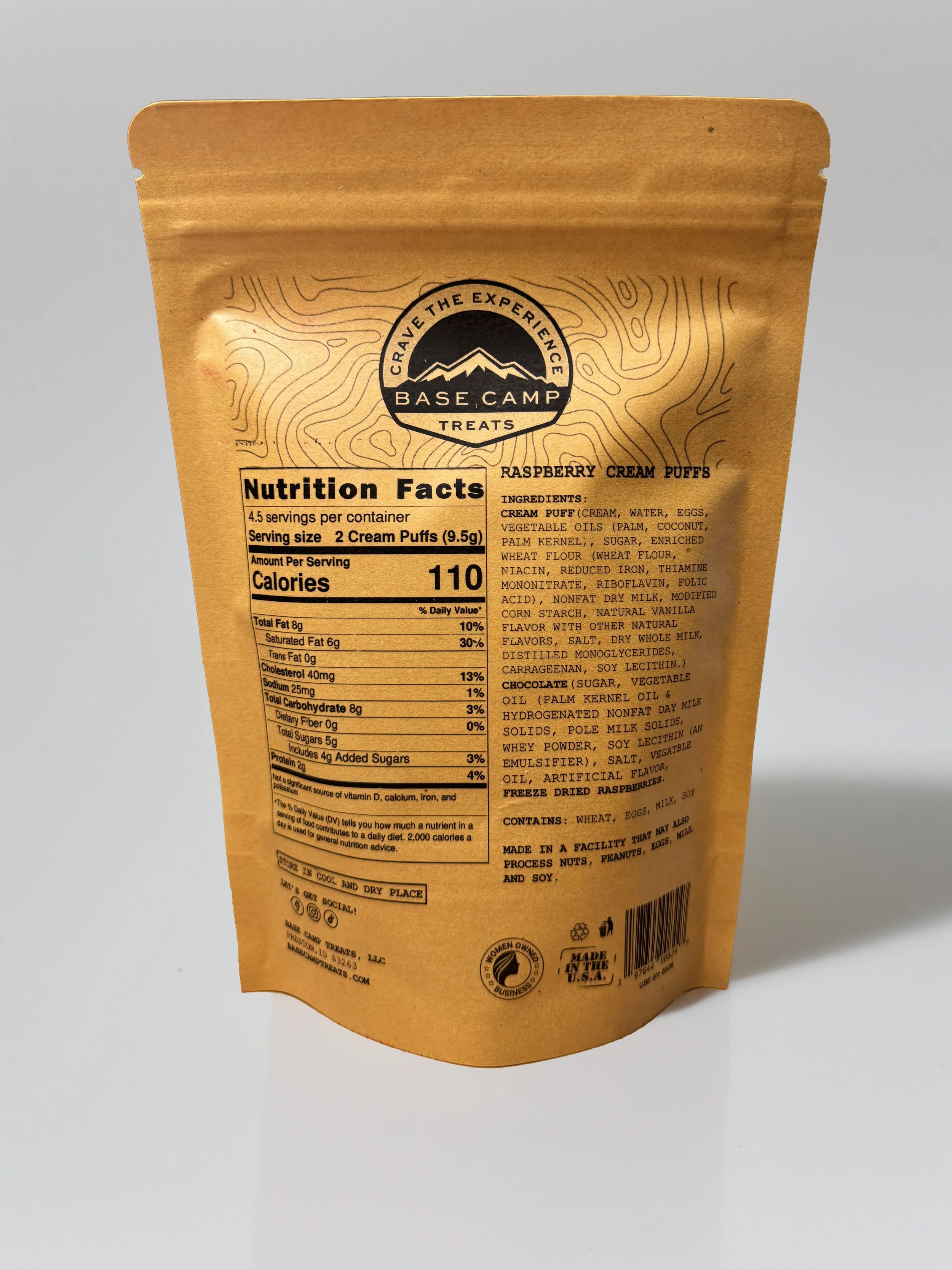 Back of Base Camp Treats Freeze Dried Raspberry Cream Puffs bag showing nutrition facts, ingredients, and kraft packaging.