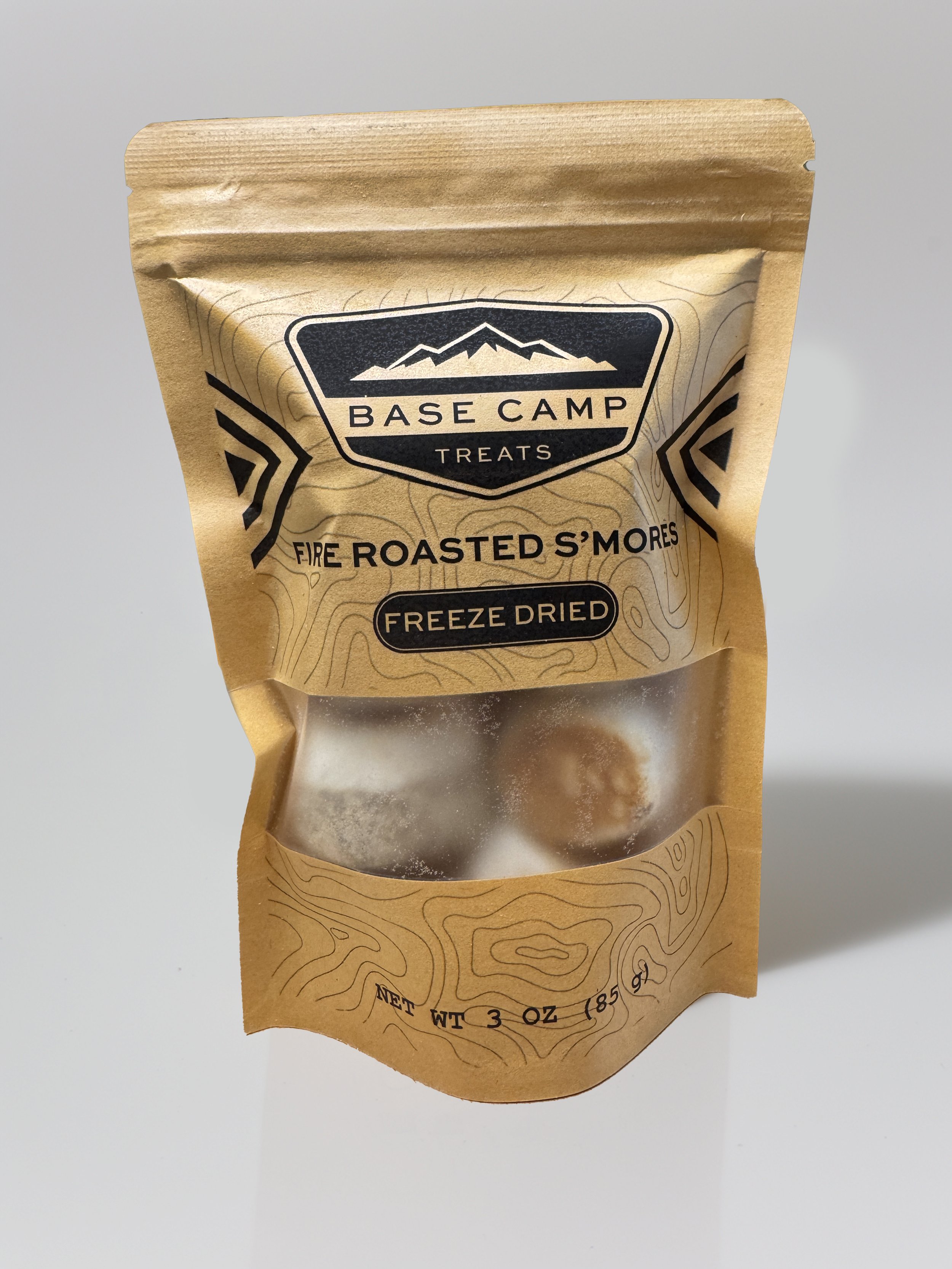 Base Camp Treats Freeze Dried Fire Roasted S’mores in kraft stand-up pouch with toasted marshmallow pieces visible through window