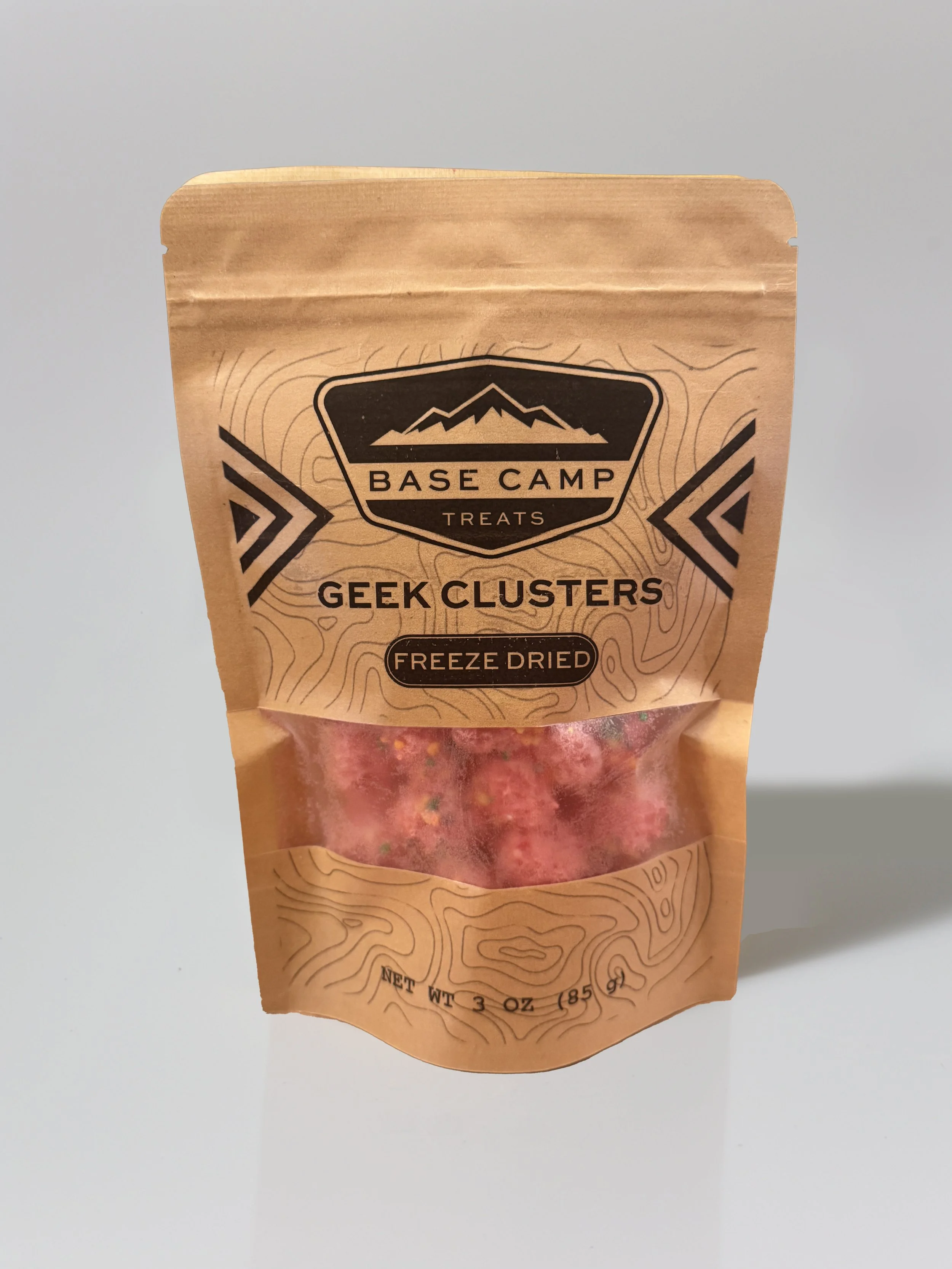 Freeze Dried Nerd Gummy Clusters in Base Camp Treats stand-up pouch — pink crunchy candy bites visible through clear window on kraft packaging