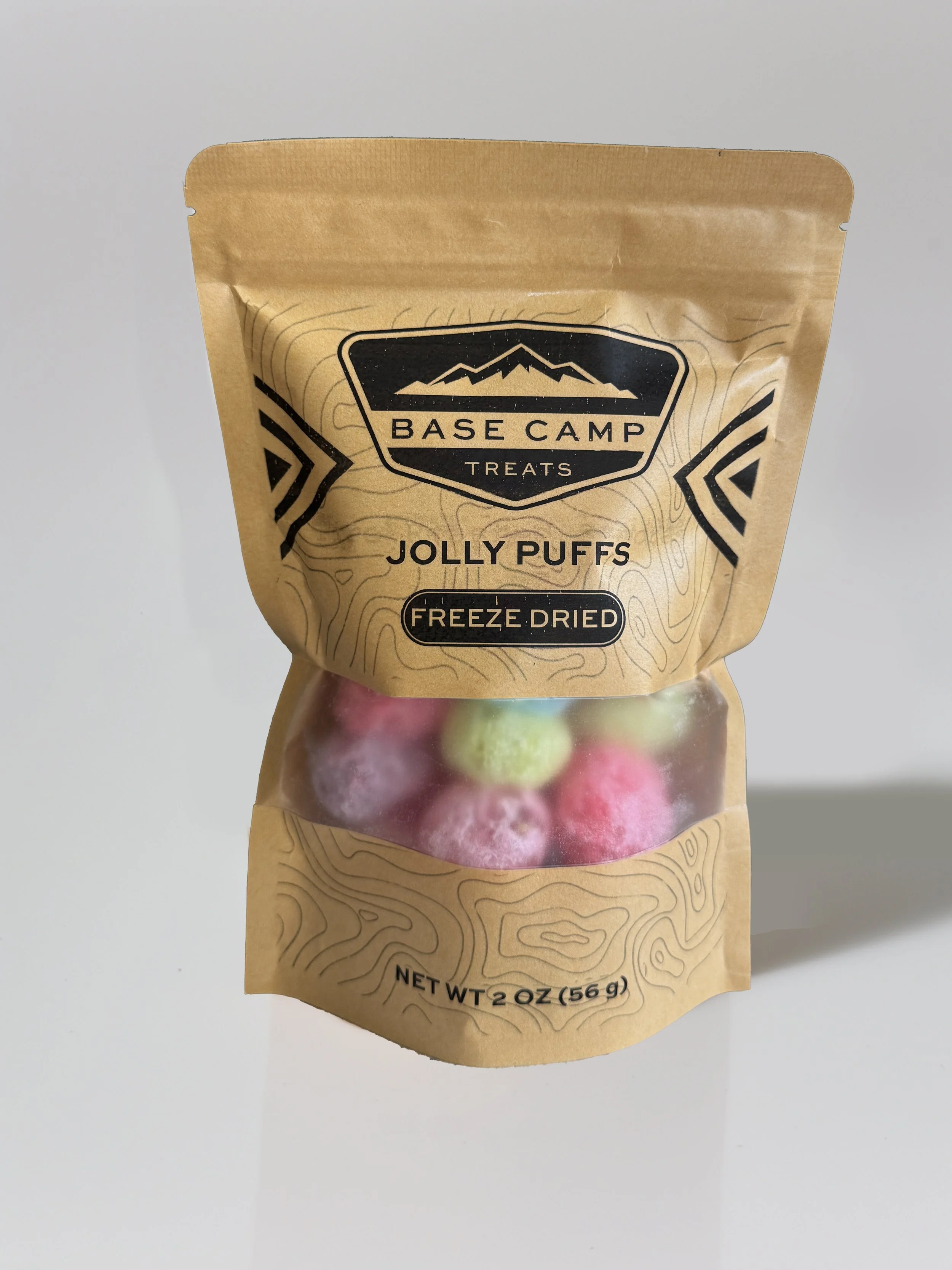Base Camp Treats Freeze Dried Jolly Ranchers in kraft stand-up pouch with colorful puffed fruity candy visible through clear window.