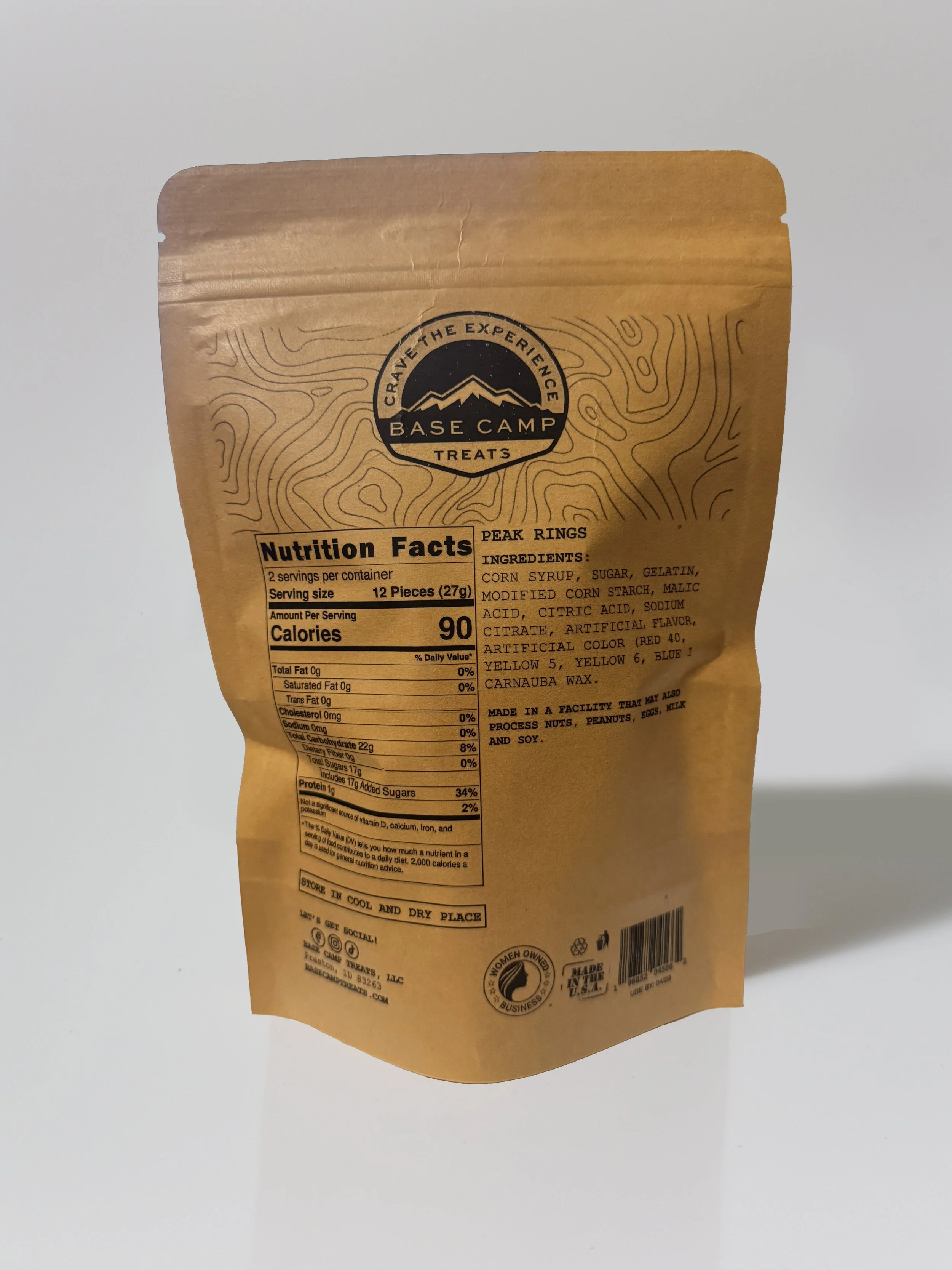 Back of Base Camp Treats Freeze Dried Peach Rings bag showing nutrition facts, ingredients, and kraft packaging.