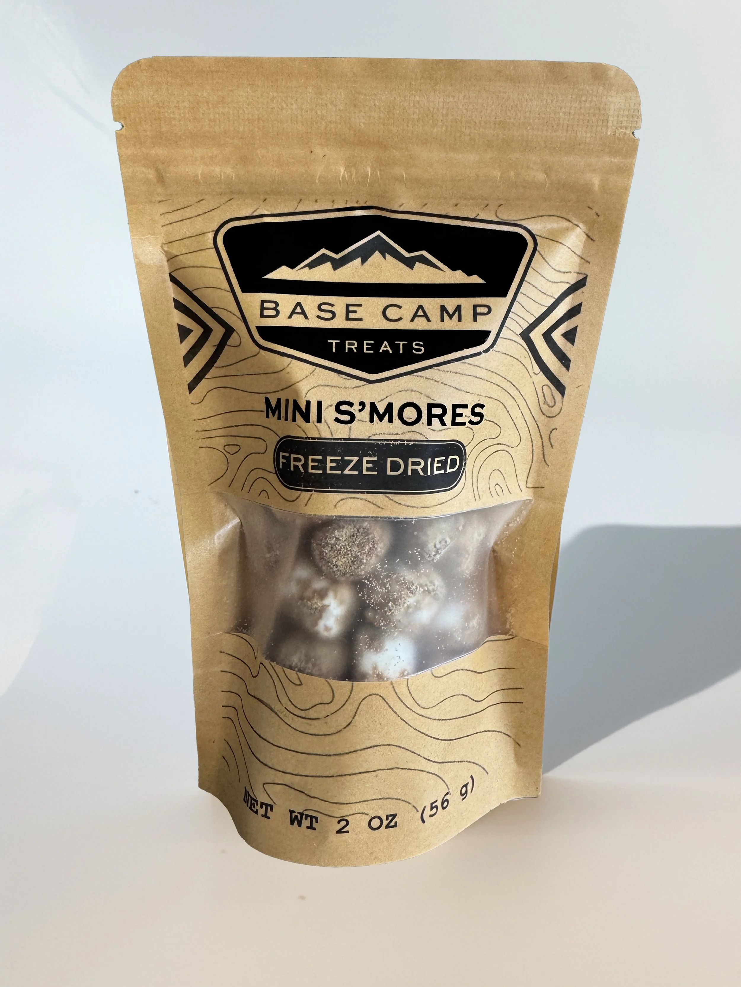 Base Camp Treats Freeze Dried Mini S’mores in kraft stand-up pouch with bite-size toasted marshmallows visible through clear window