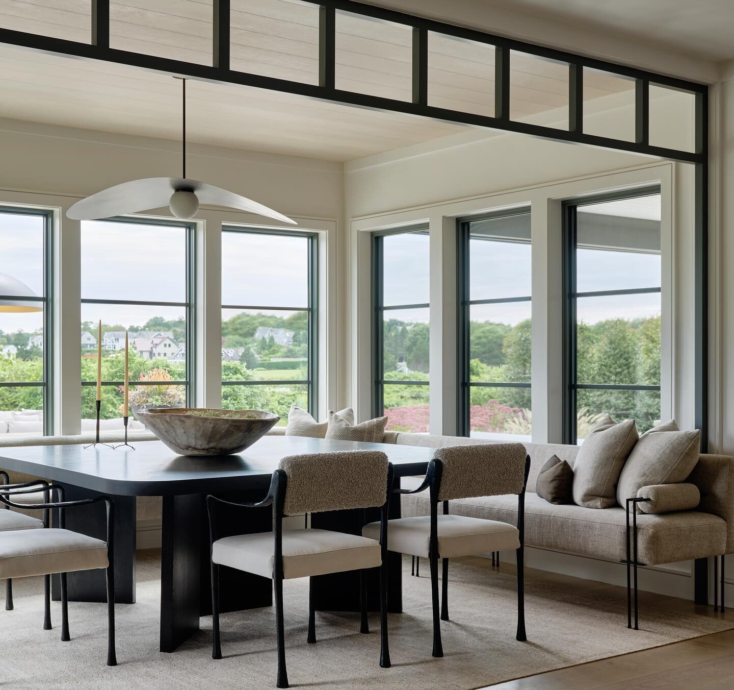 Interior transoms and ceiling treatments are great tools in defining certain living spaces, especially in an otherwise open floor plan. This dining area at our Cove House project still feels like an extension of the great room, while emulating a cozy