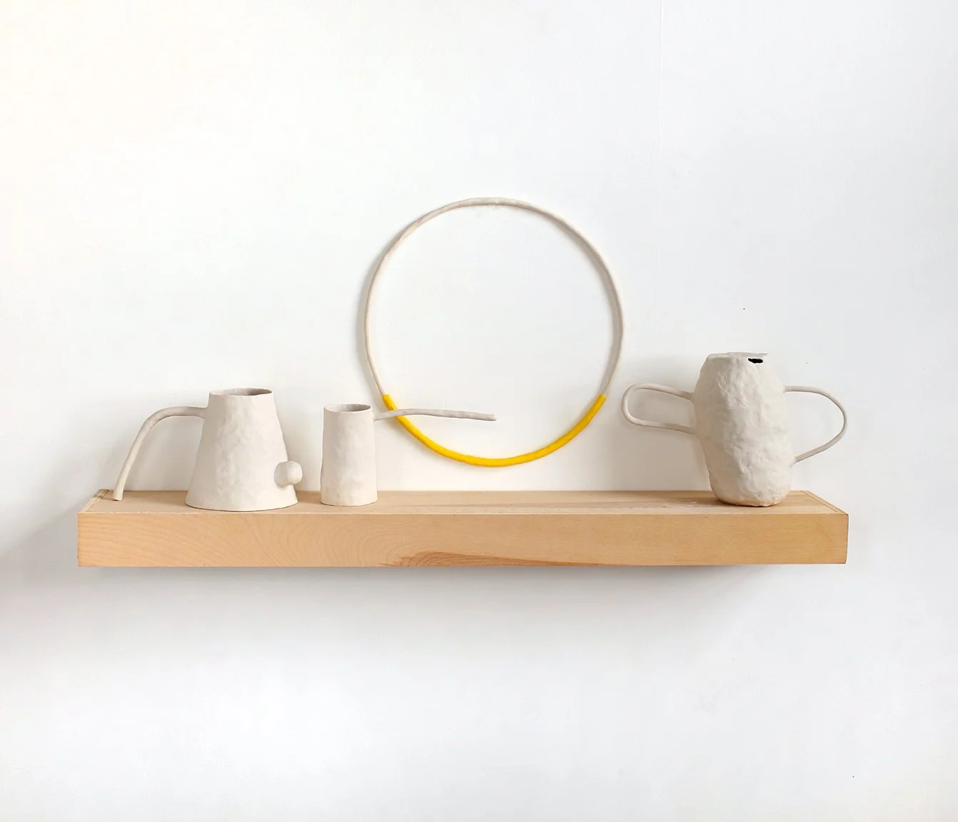   An alphabet of makeshift days (Promenade)  Porcelain, thermoplastic clay, wood 16” x 36” x 7”  