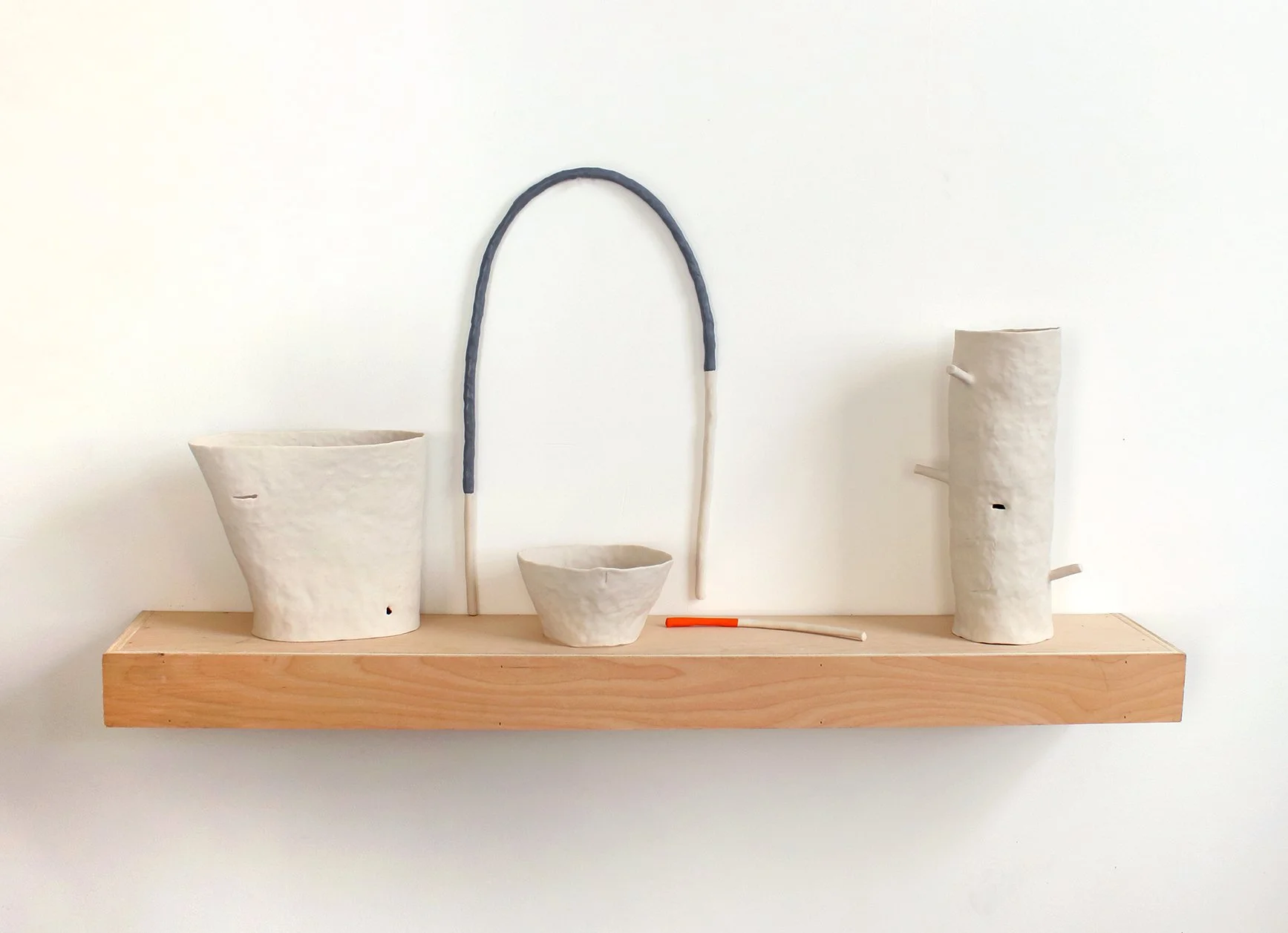   An alphabet of makeshift days (Nightfall)  Porcelain, thermoplastic clay, flashe, wood 17” x 36” x 7” 