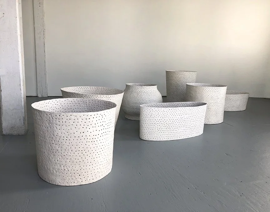   Seven Volumes,  installation view Terra cotta, terra sigillata, milk paint Dimensions variable (21-36” diameter) 