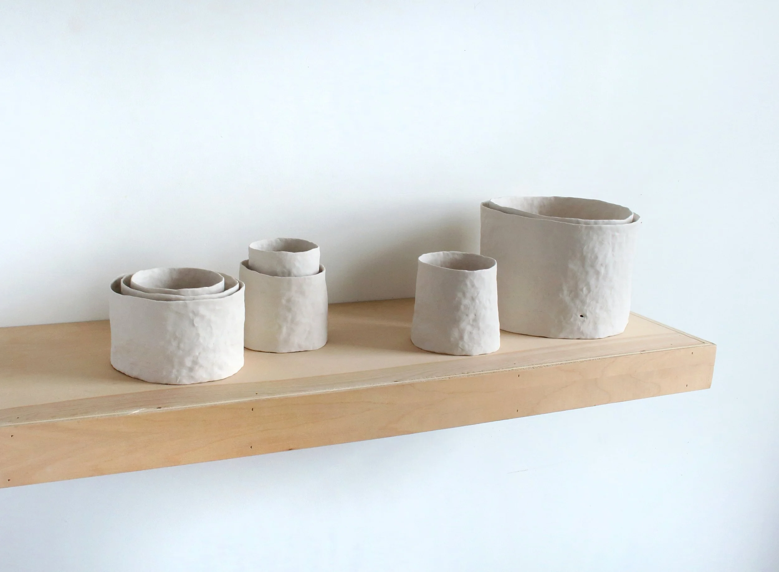   An alphabet of makeshift days (nesting)  Porcelain, wood 8” x 36” x 12” 