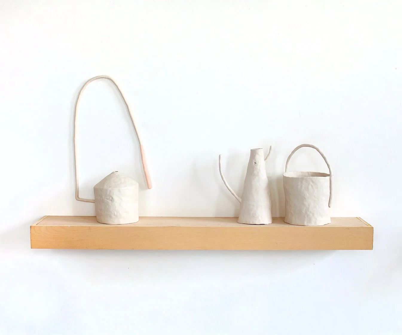   An alphabet of makeshift days (Winter Light)  Porcelain, thermoplastic clay, wood 18” x 36” x 7”  